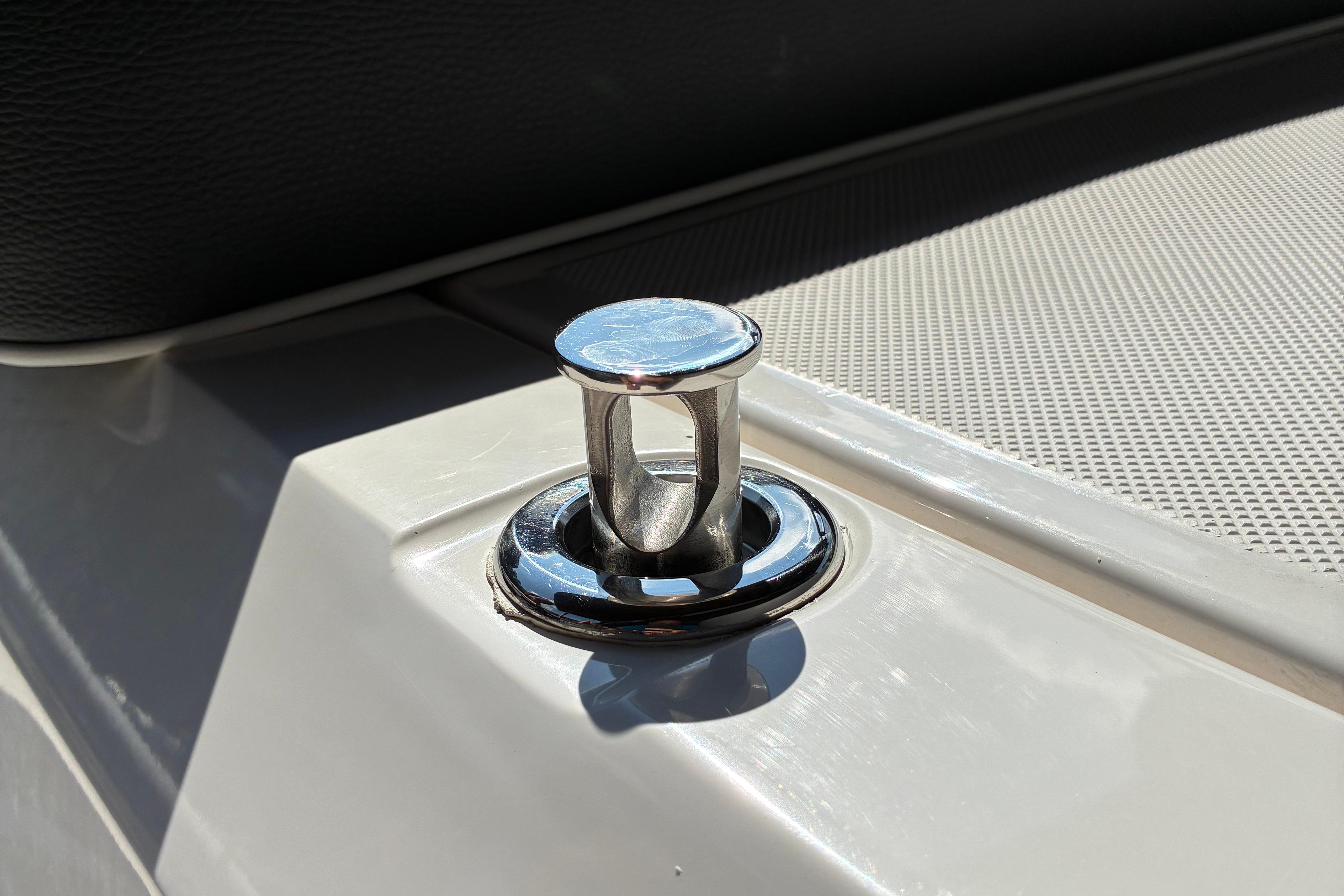 Chrome cleat on 2025 Regal LS2 boat deck, close-up view.