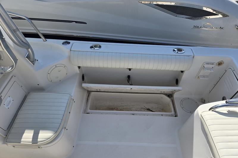 2004 Robalo R235 Walkaround boat interior with seating and storage compartments.