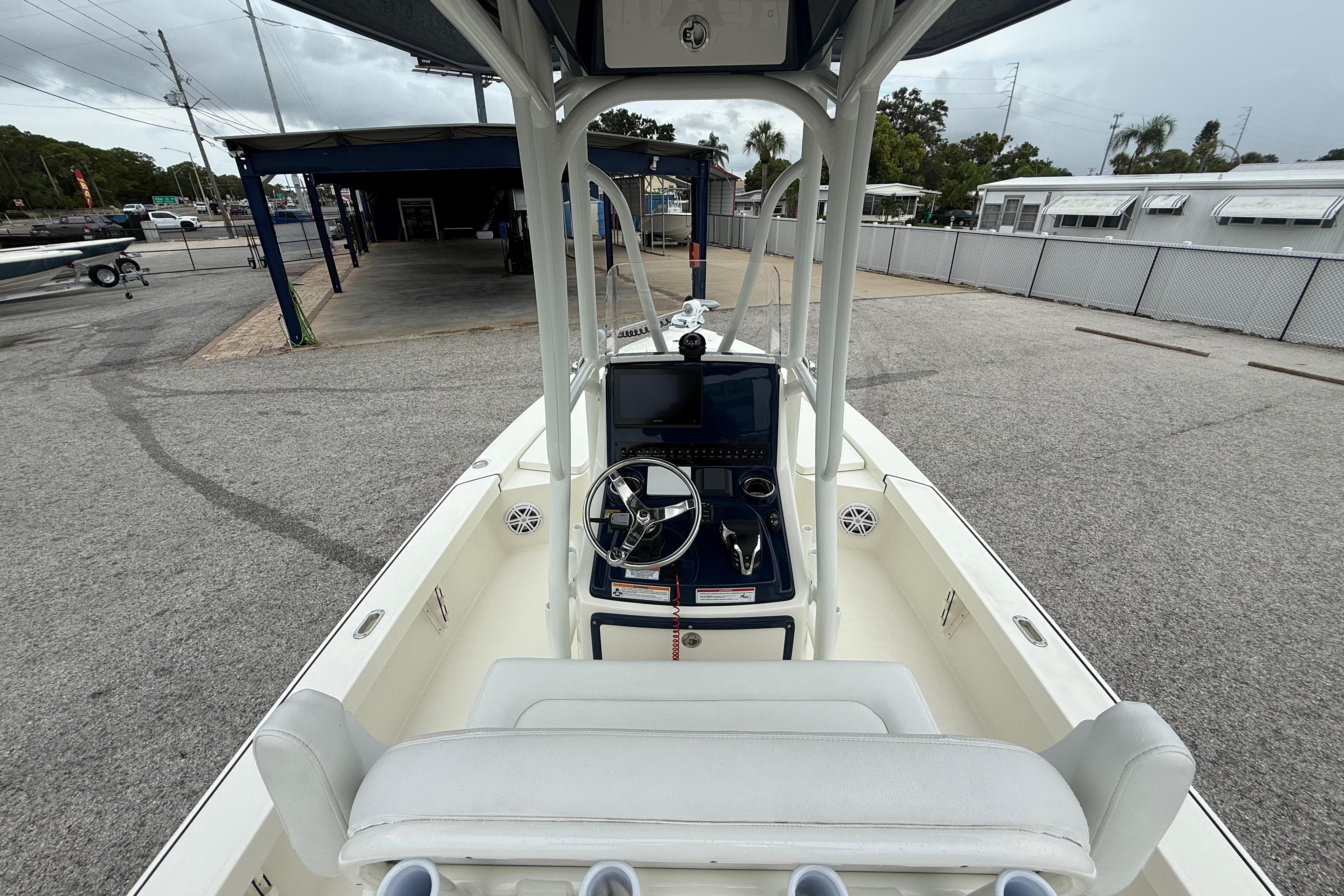 2026 Pathfinder 2300 HPS boat interior with steering console and seating.