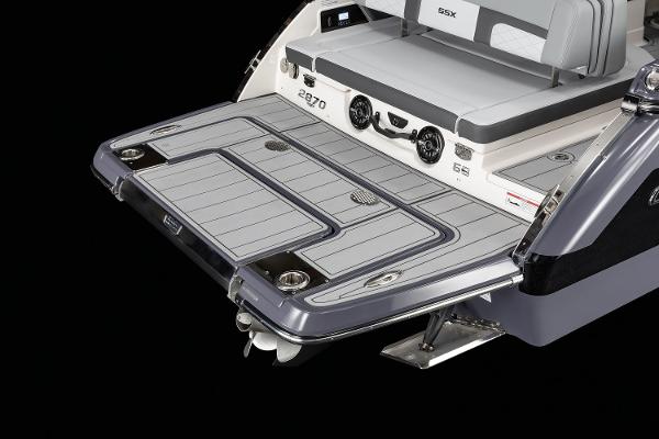2025 Chaparral 2870 boat swim platform with seating and speakers, showcasing modern design.