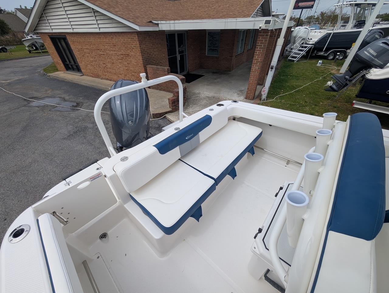 2025 Robalo R222 Explorer boat interior with seating and rod holders.