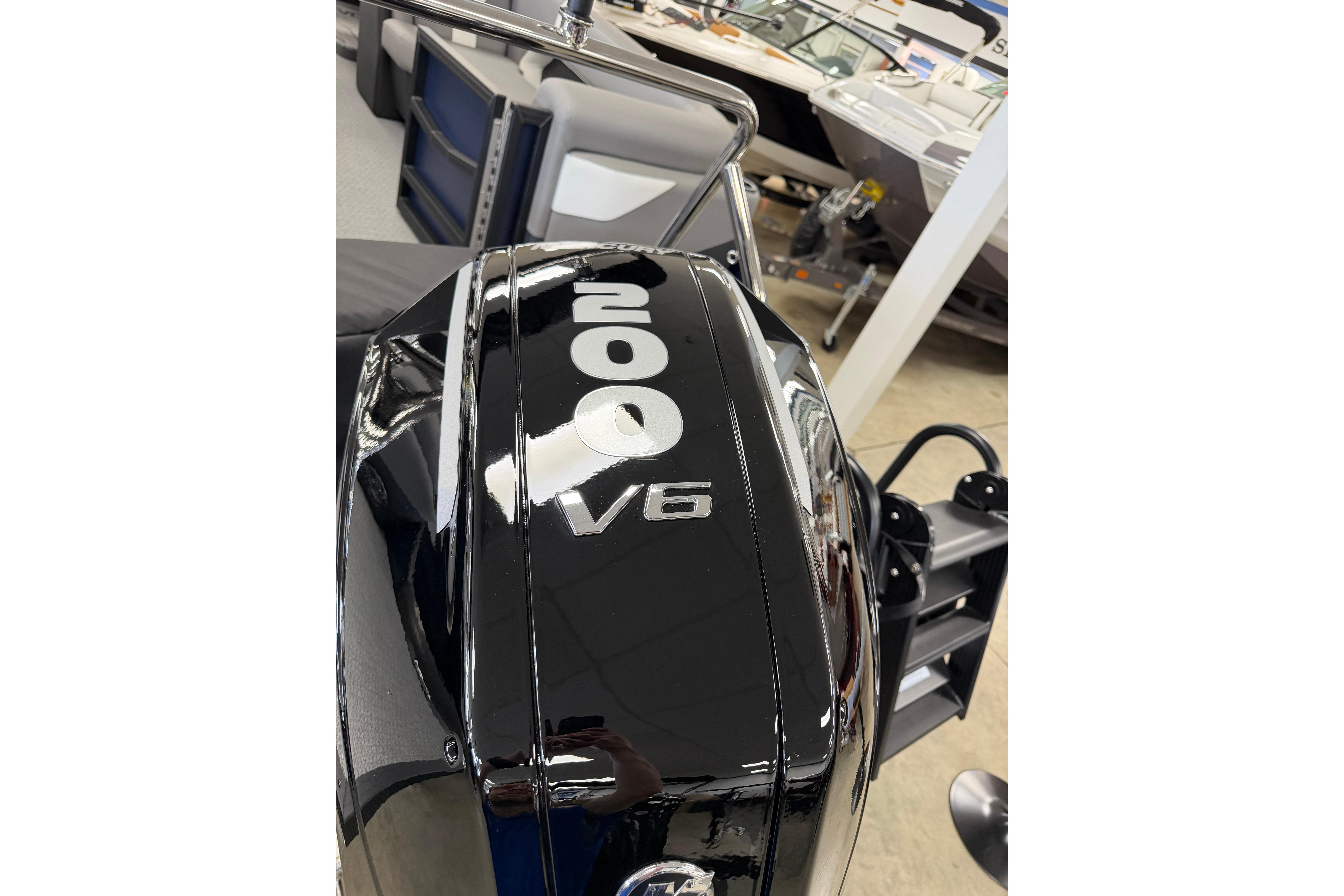 Evotti 523QL 2026 V6 outboard motor, 200 horsepower, in showroom setting.