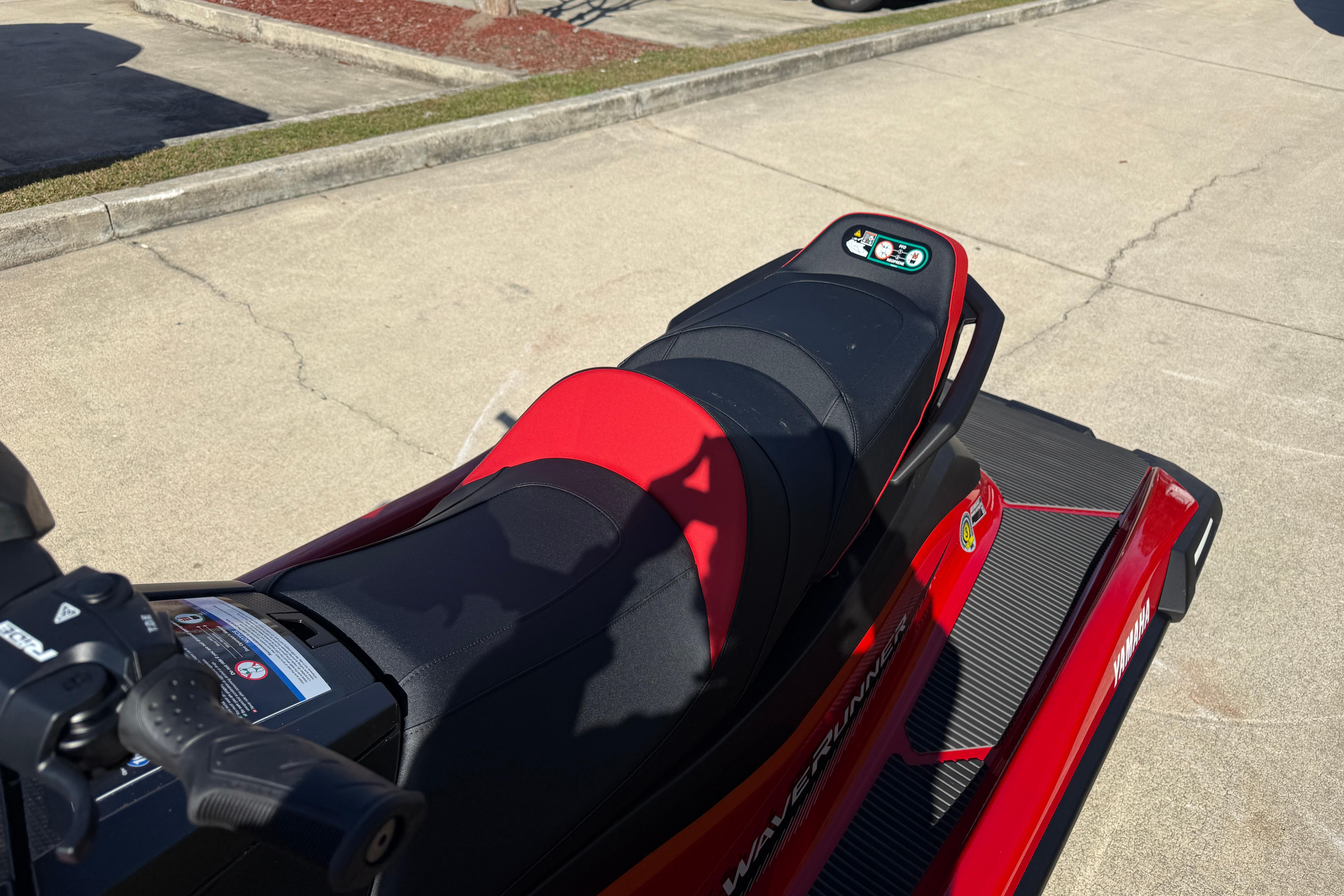 2026 Yamaha WaveRunner VX Cruiser in red, parked on a concrete surface.