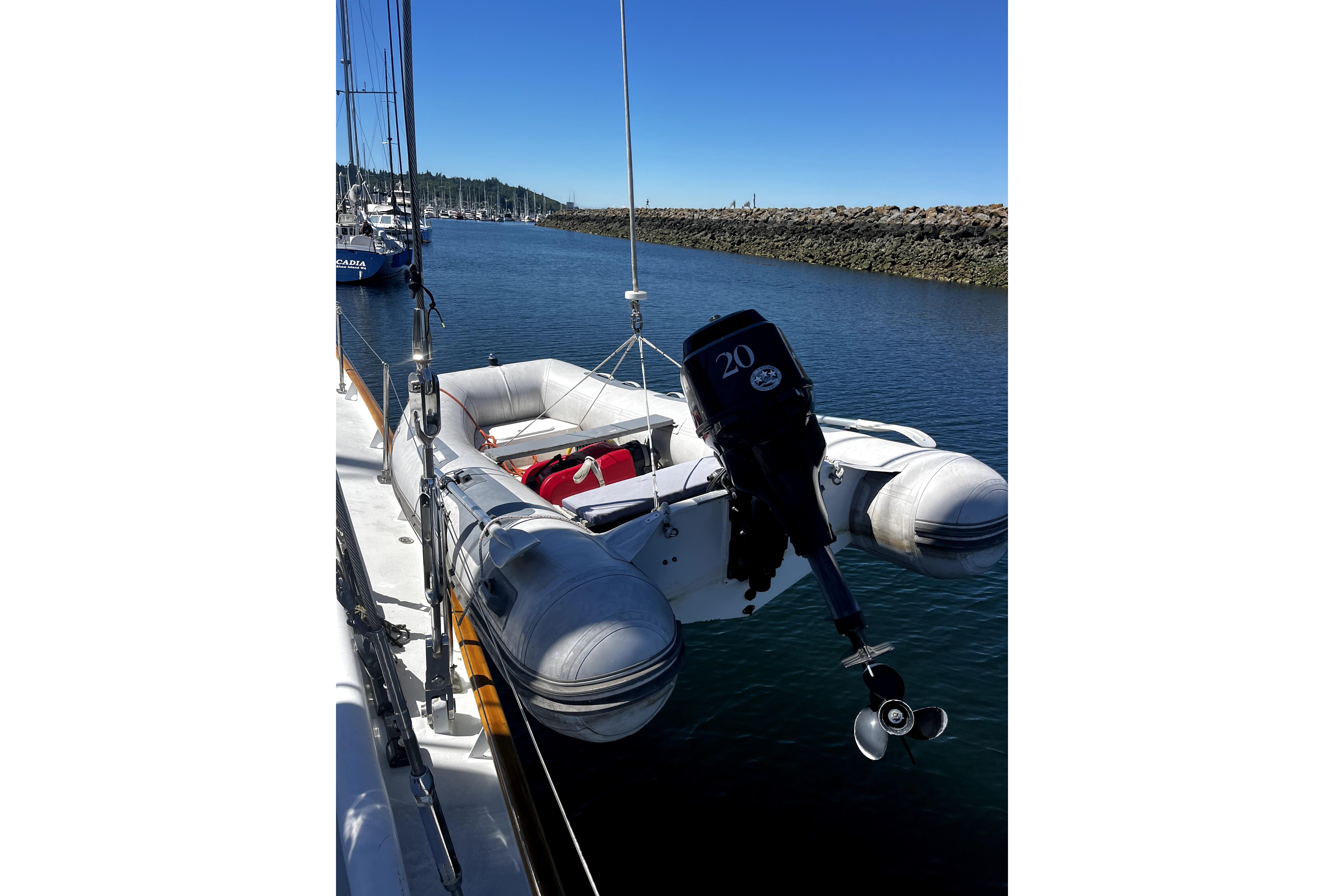 Inflatable dinghy with outboard motor on Abeking & Rasmussen Tripp 74 yacht, 1968 model.