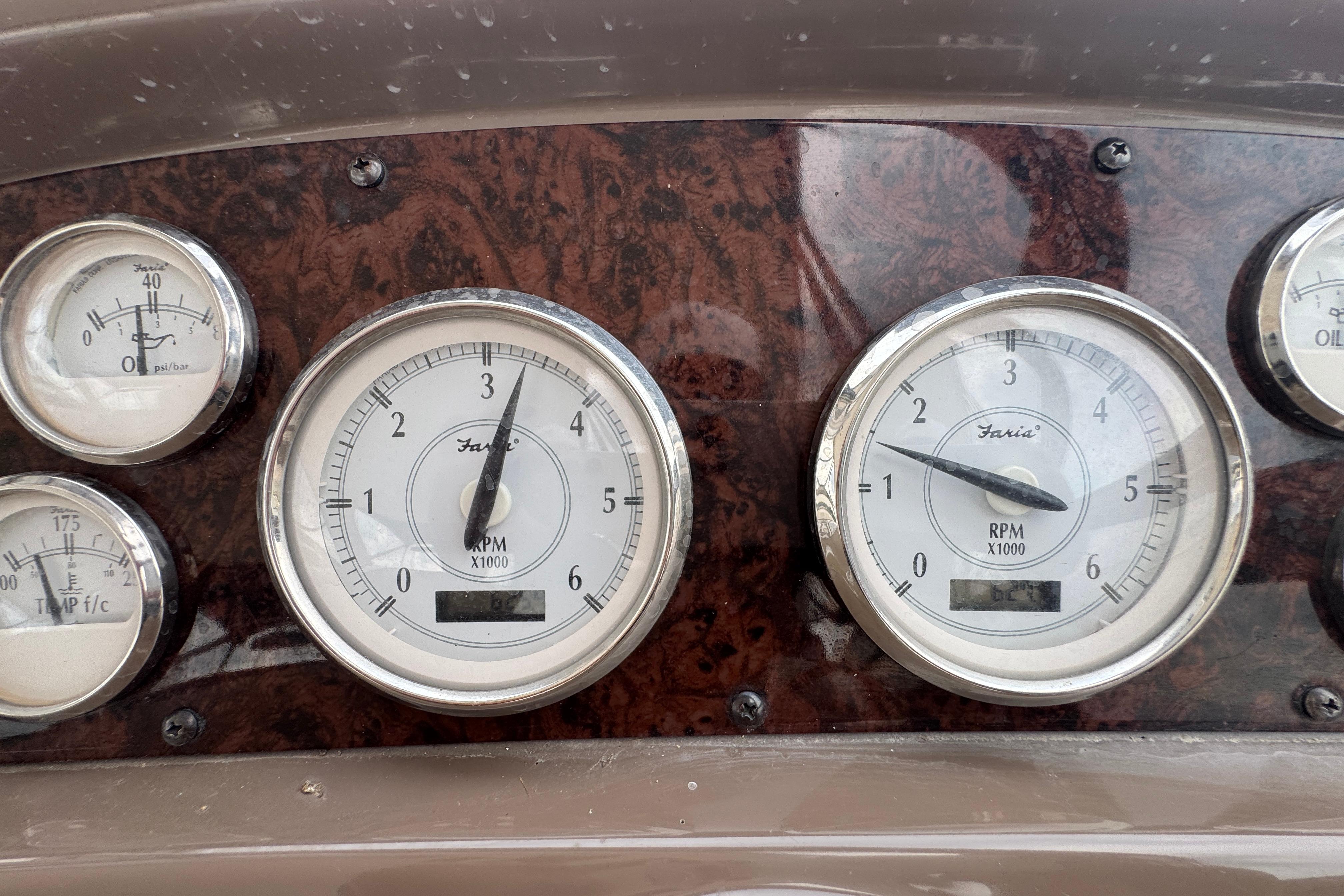 Dashboard gauges of a 2005 Regal Commodore 4260 boat, featuring RPM and pressure indicators.