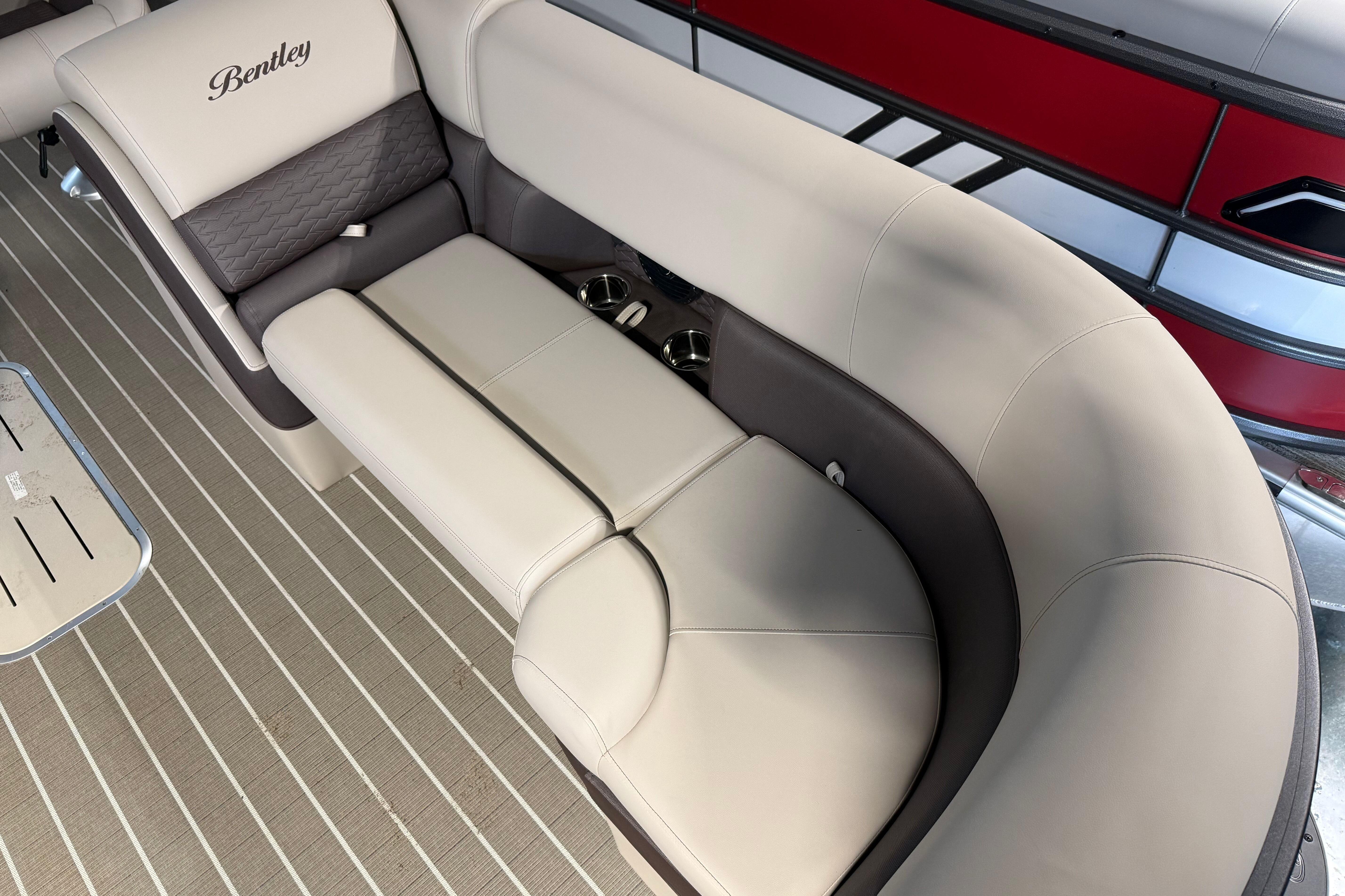 Luxurious seating on 2026 Bentley Pontoons Elite 223 Admiral, featuring elegant upholstery and cup holders.