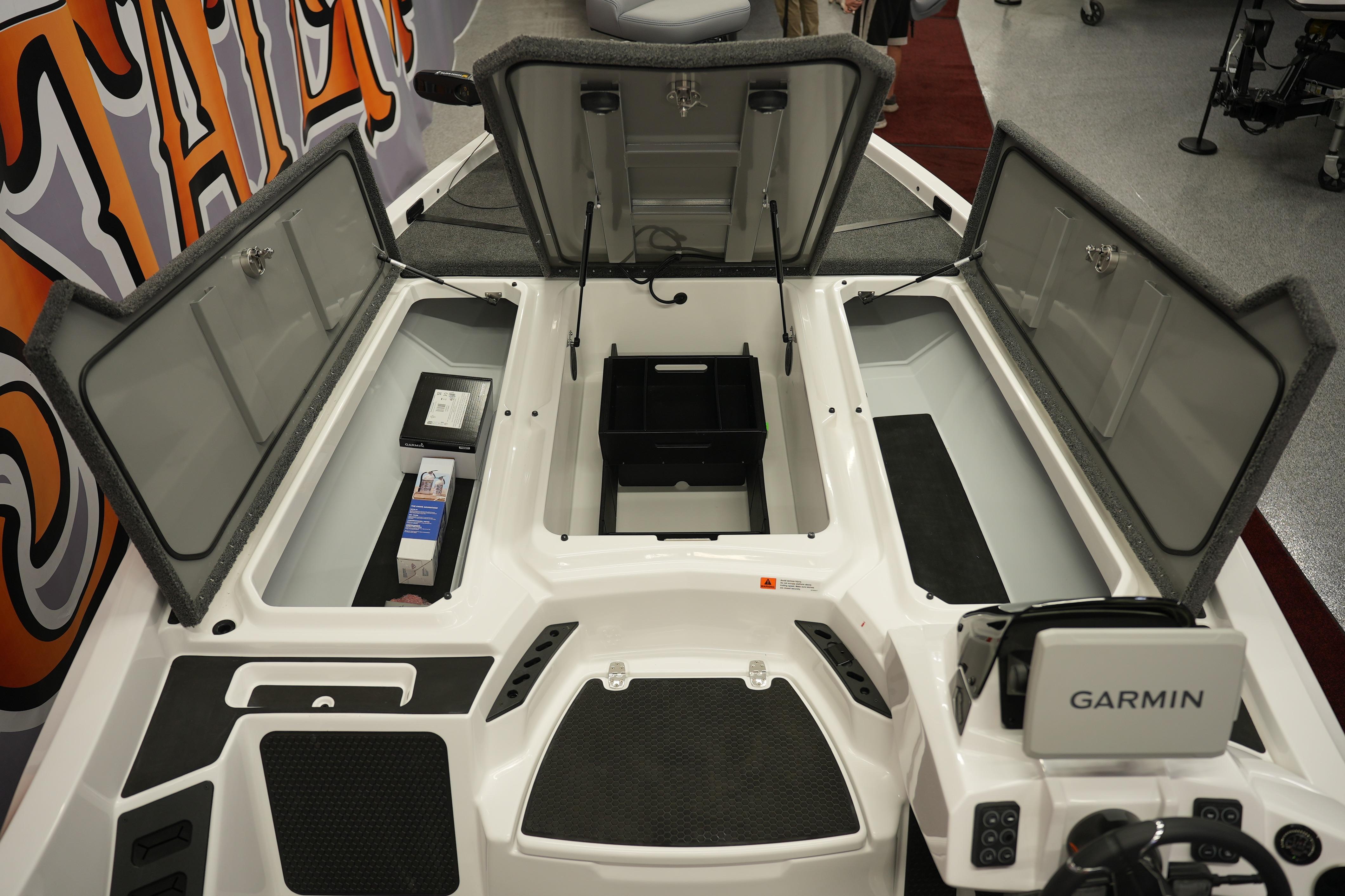 Open storage compartments on a 2026 iKon VLE21 boat with Garmin equipment.