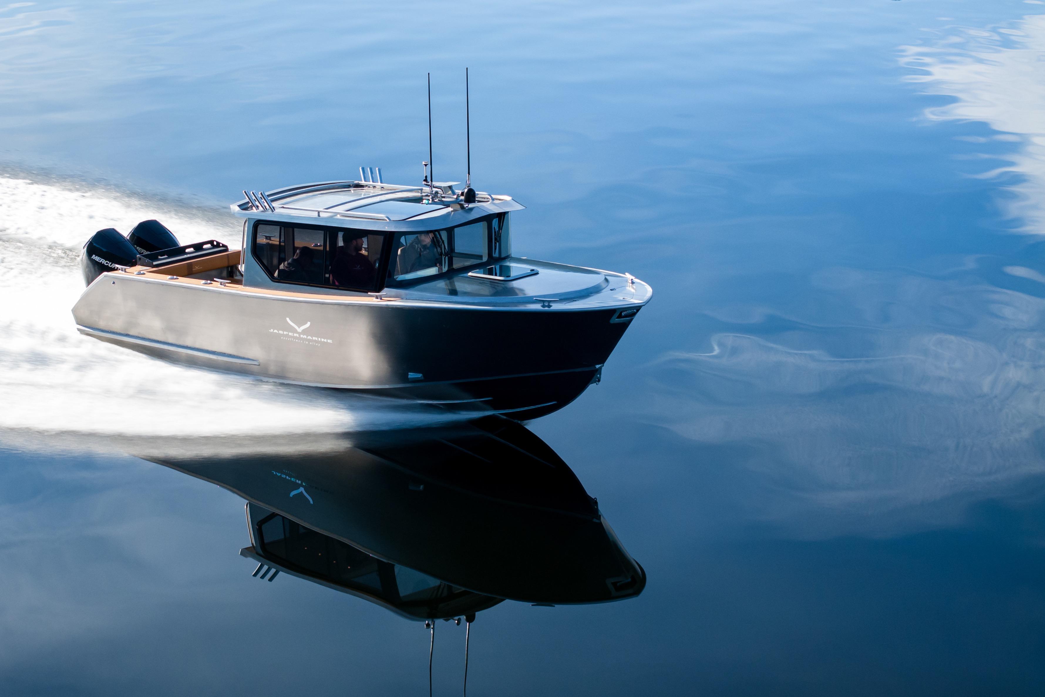 2026 Jasper Marine Defender 22 cruising on calm water, showcasing sleek design and performance.