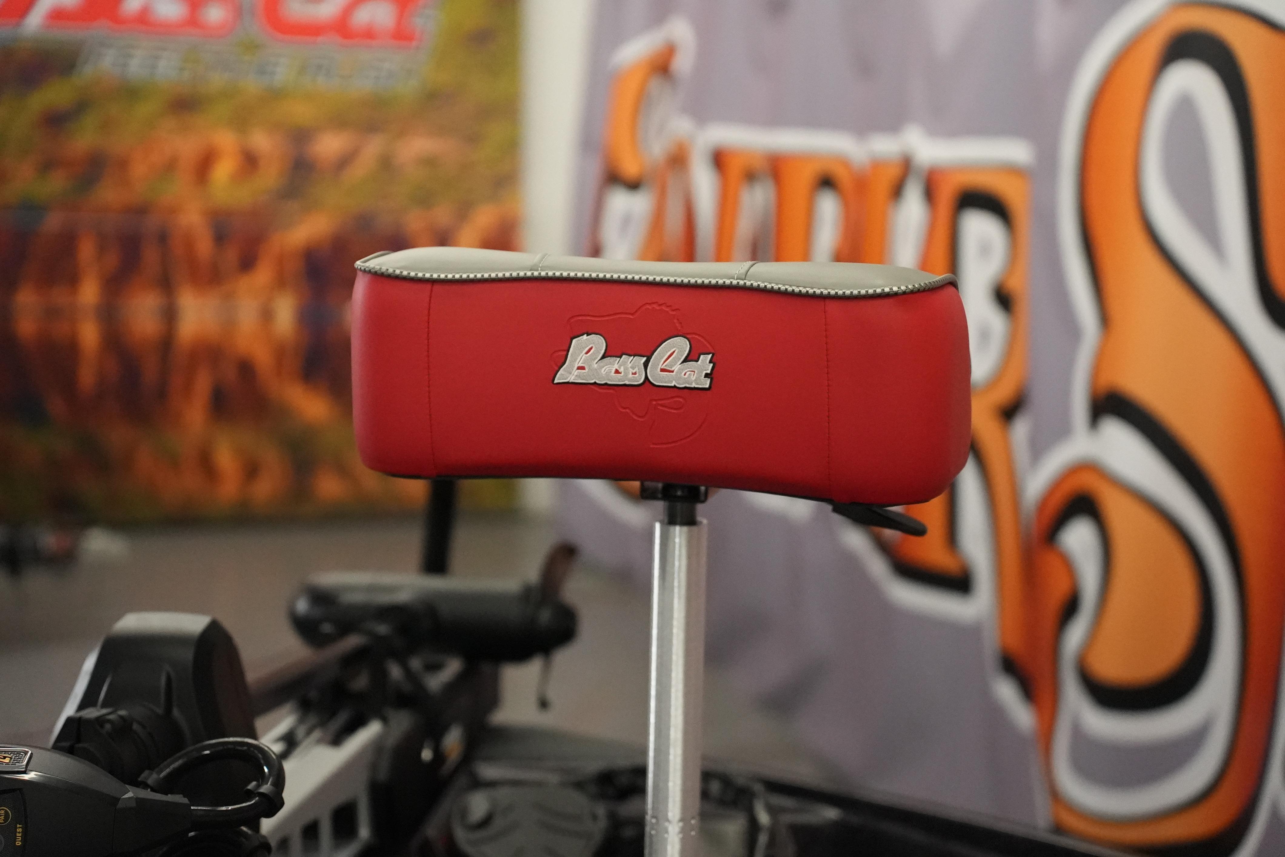 Red seat of 2026 Bass Cat Lynx STS boat with logo detail.