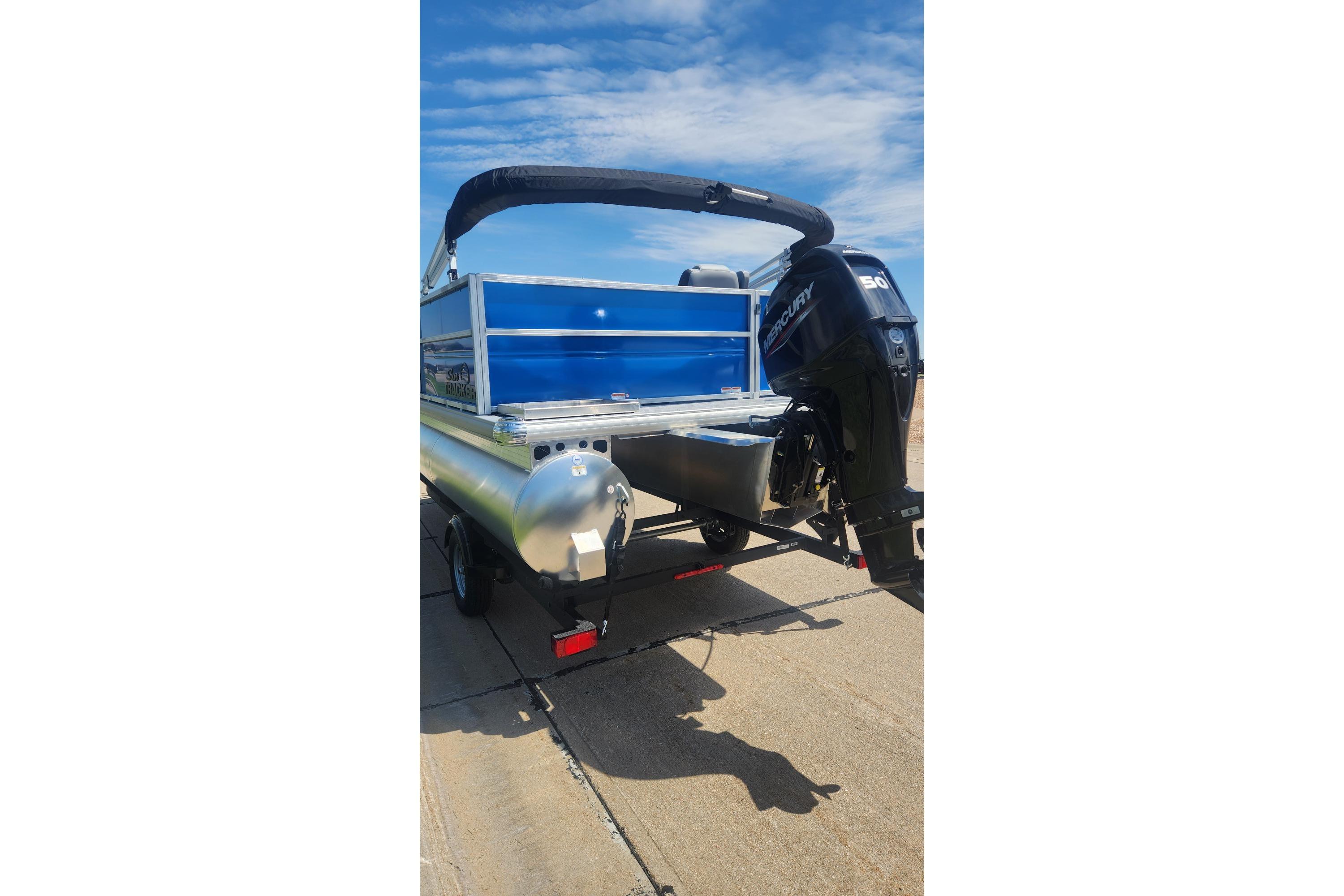 2026 Sun Tracker Party Barge 16 DLX pontoon boat with Mercury outboard motor.