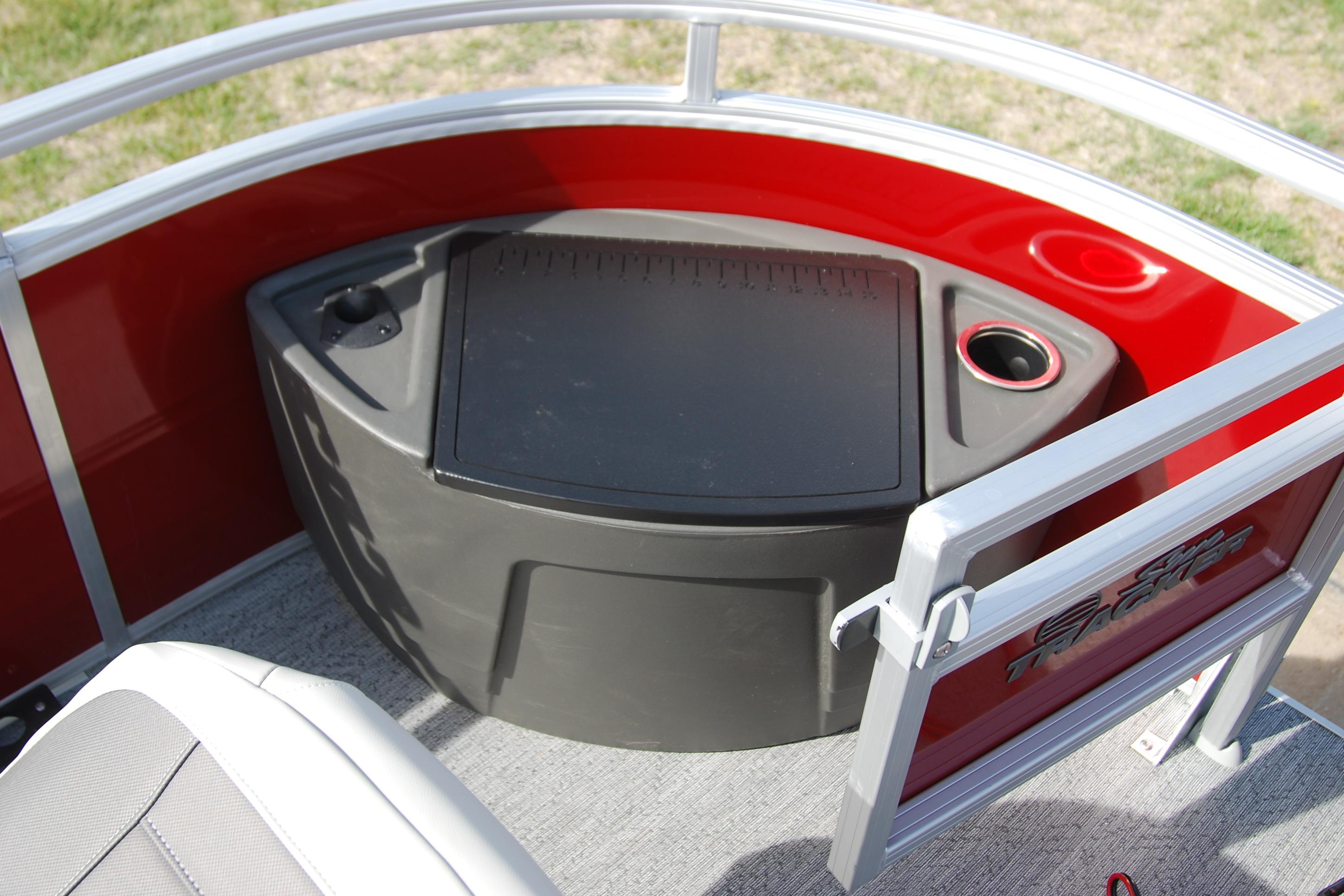 2026 Sun Tracker Fishin' Barge 22 XP3, red interior with storage compartment.