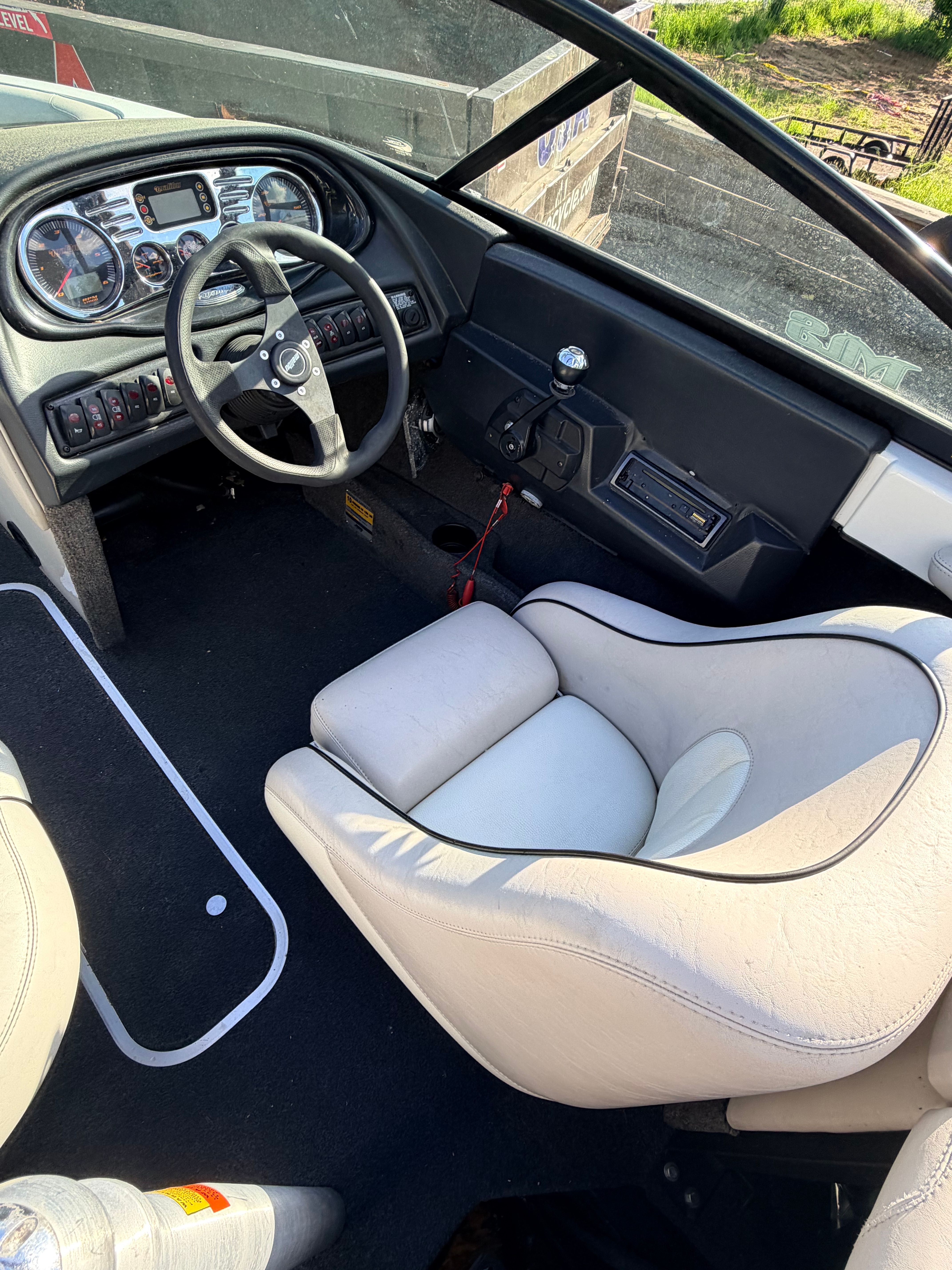 Interior of a 2006 Malibu iRide boat with steering console.