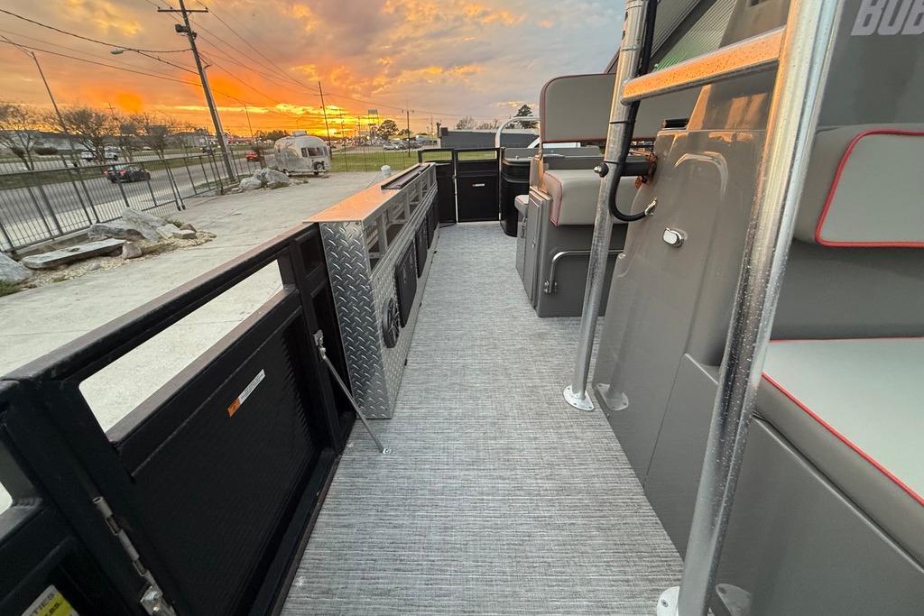 2022 Apex Marine 8524 Pro Fish N Cruise boat interior at sunset, showcasing seating and storage.