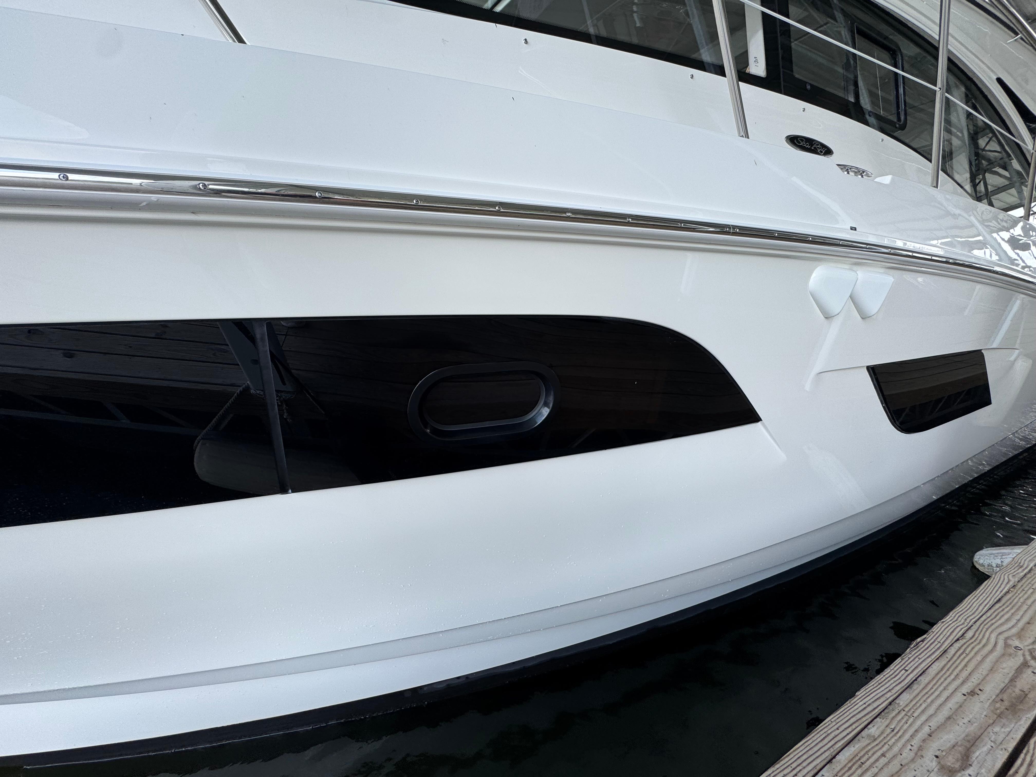 2017 Sea Ray Sundancer 400 yacht docked, showcasing sleek white hull design.