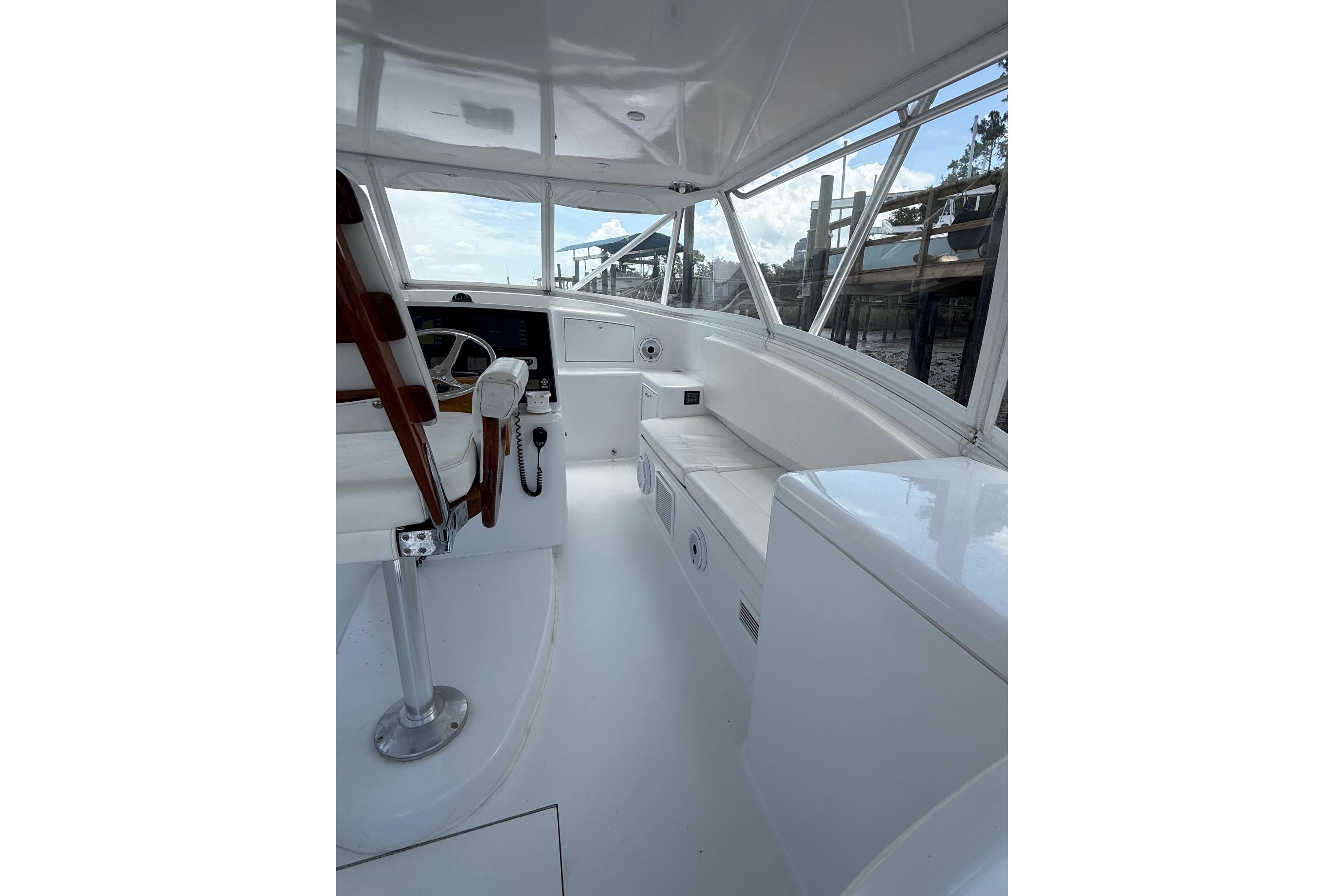 2006 Custom Carolina Heritage Express boat interior with helm and seating area.