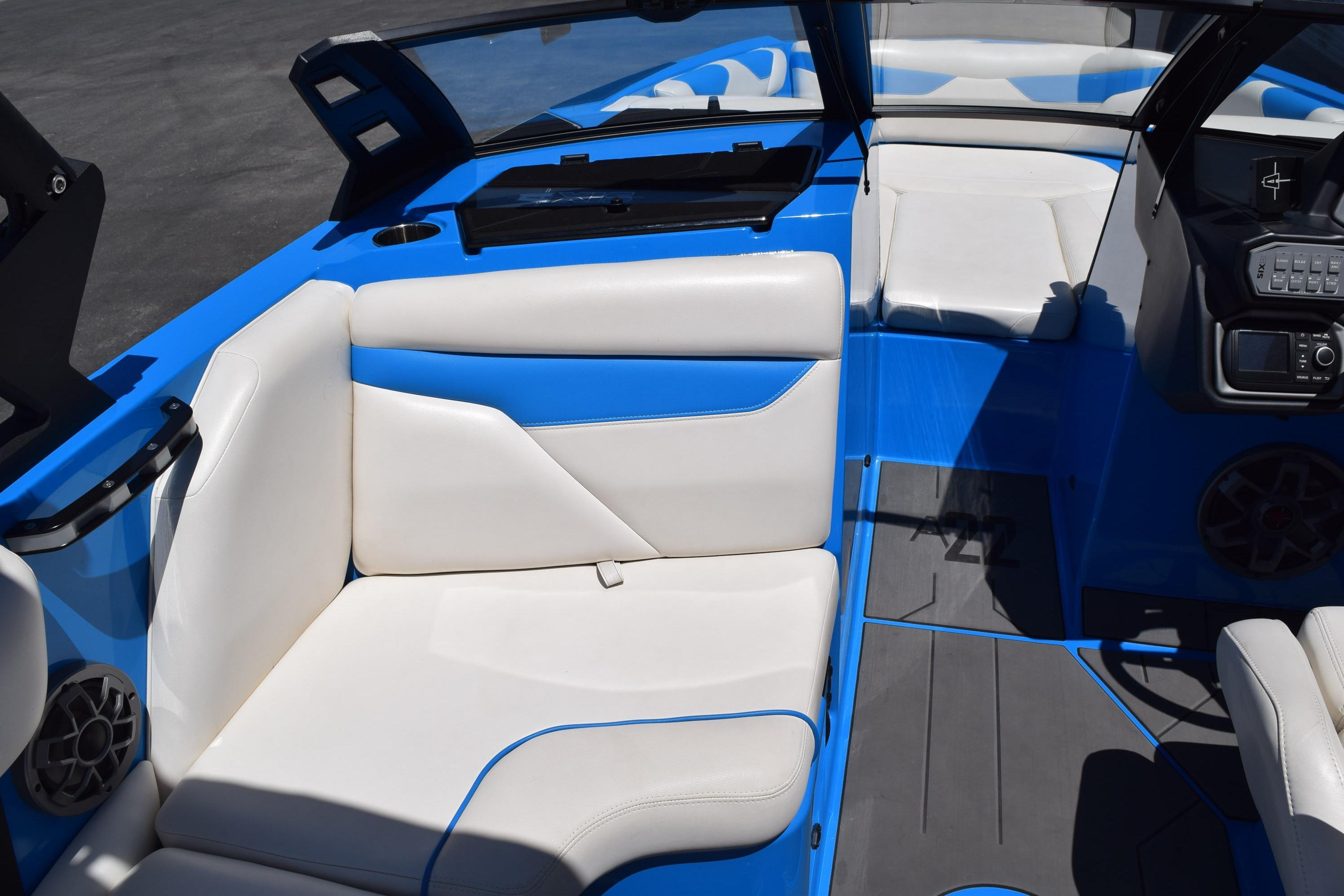 2019 Axis A22 boat interior with white and blue seating, modern dashboard, and spacious layout.