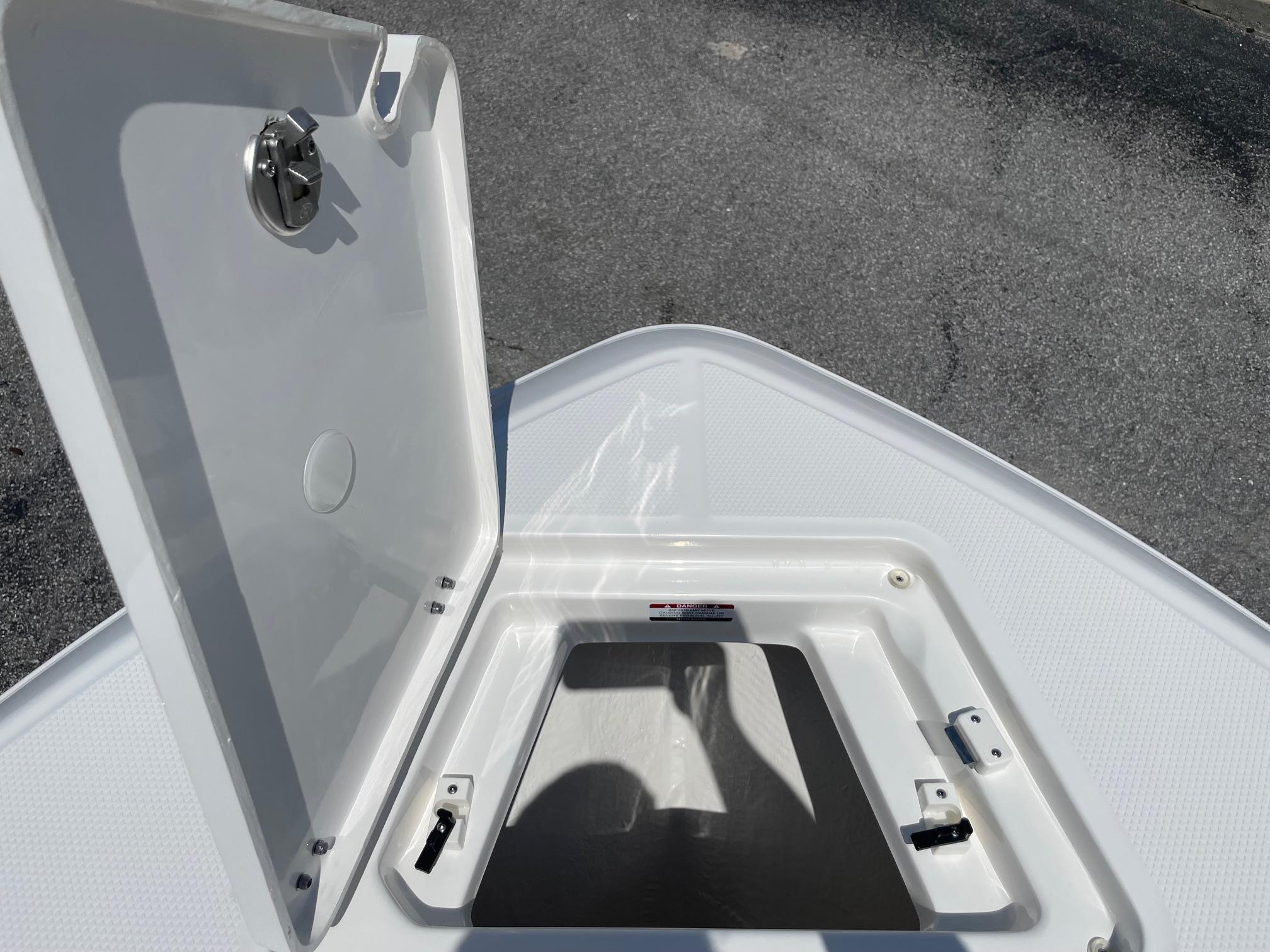Open storage compartment on 2025 Robalo R230 Center Console boat.