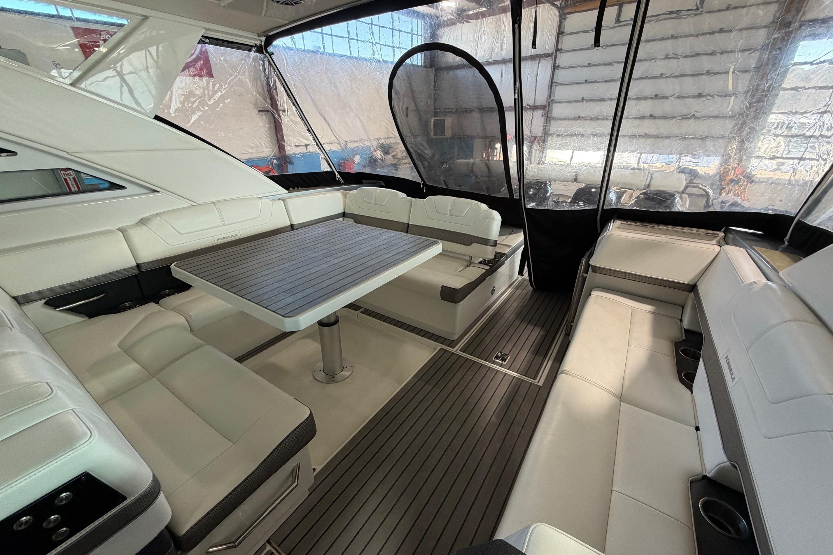 2017 Formula 430 Super Sport Crossover interior with luxurious seating and table.