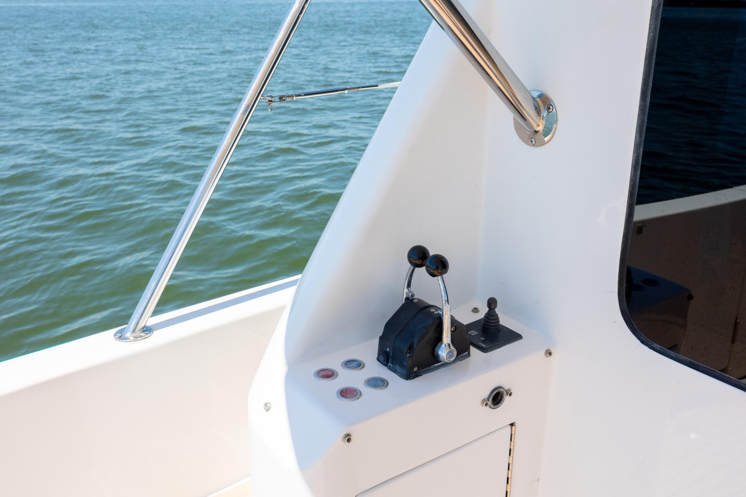Control panel of a 2005 Ocean Alexander 52 Sedan yacht with ocean view.