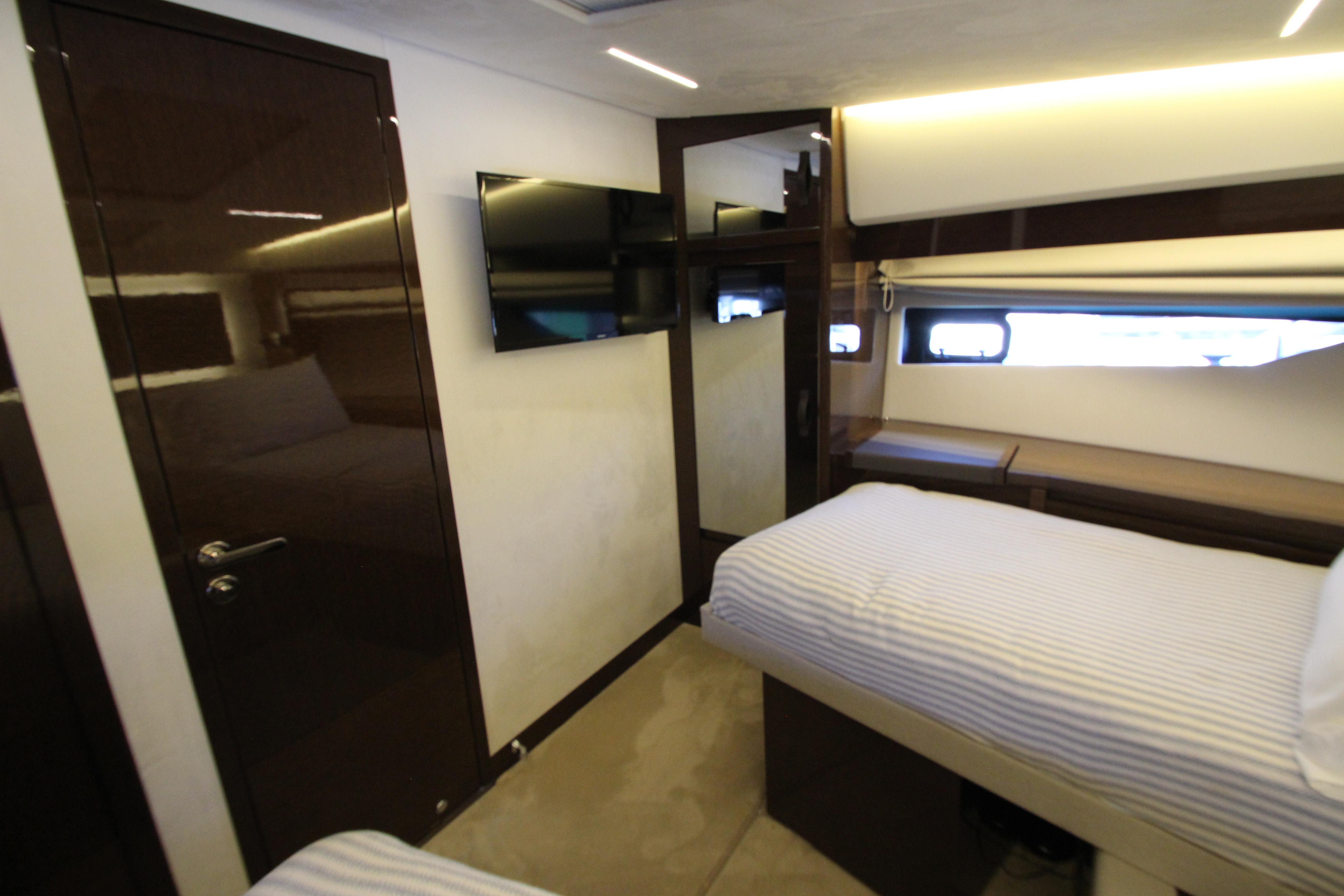 Luxurious cabin interior of 2022 Prestige 520 yacht with modern amenities and sleek design.