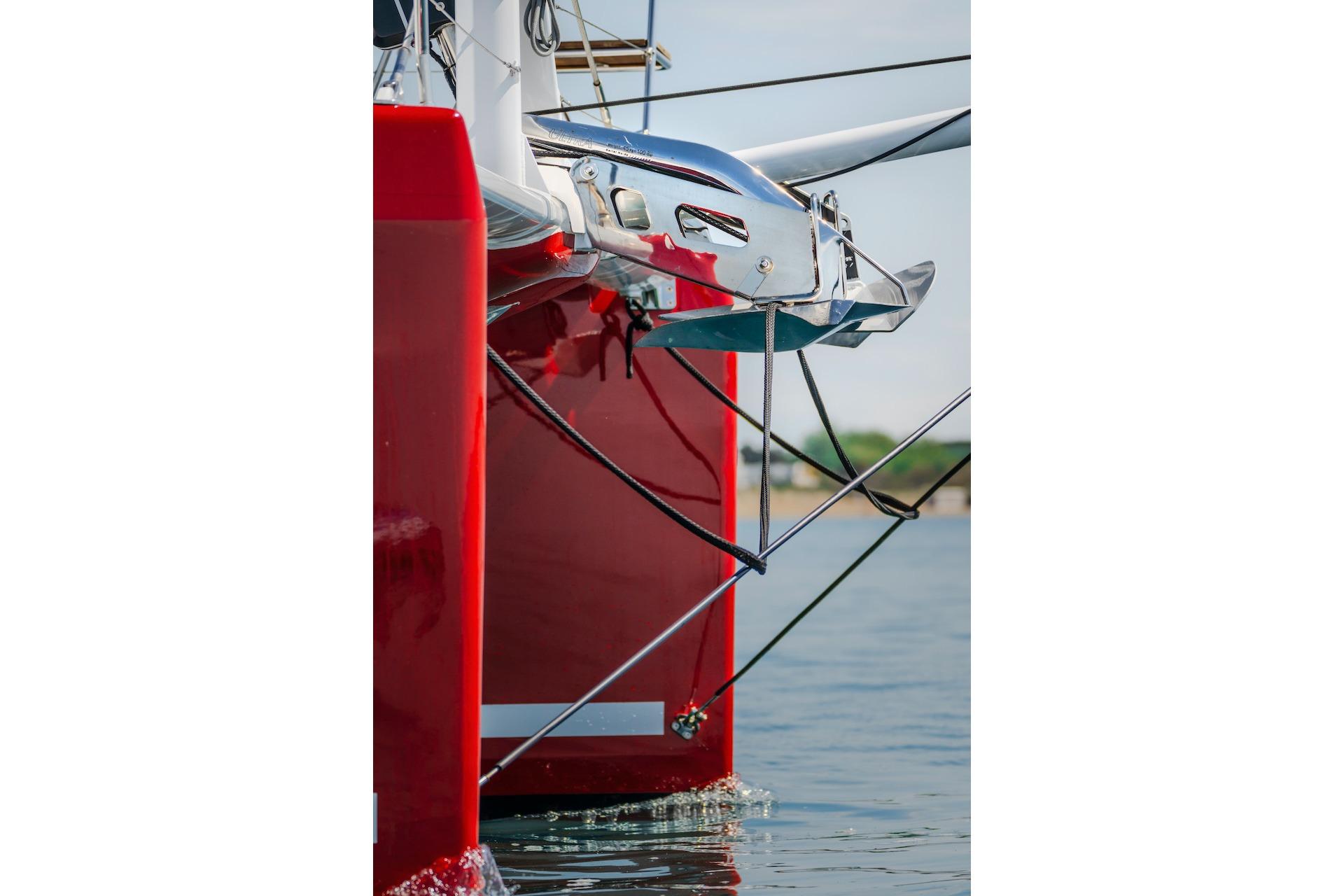 Red bow of Privilege Signature 510 catamaran, year 2025.