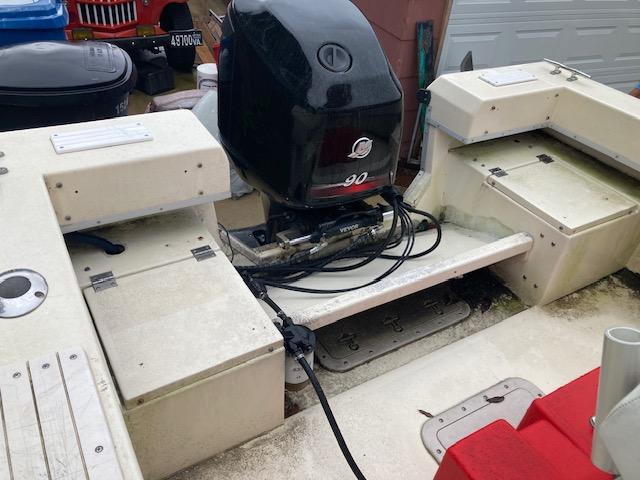 1995 KenCraft Challenger 190 boat with 90 HP outboard motor, rear view.