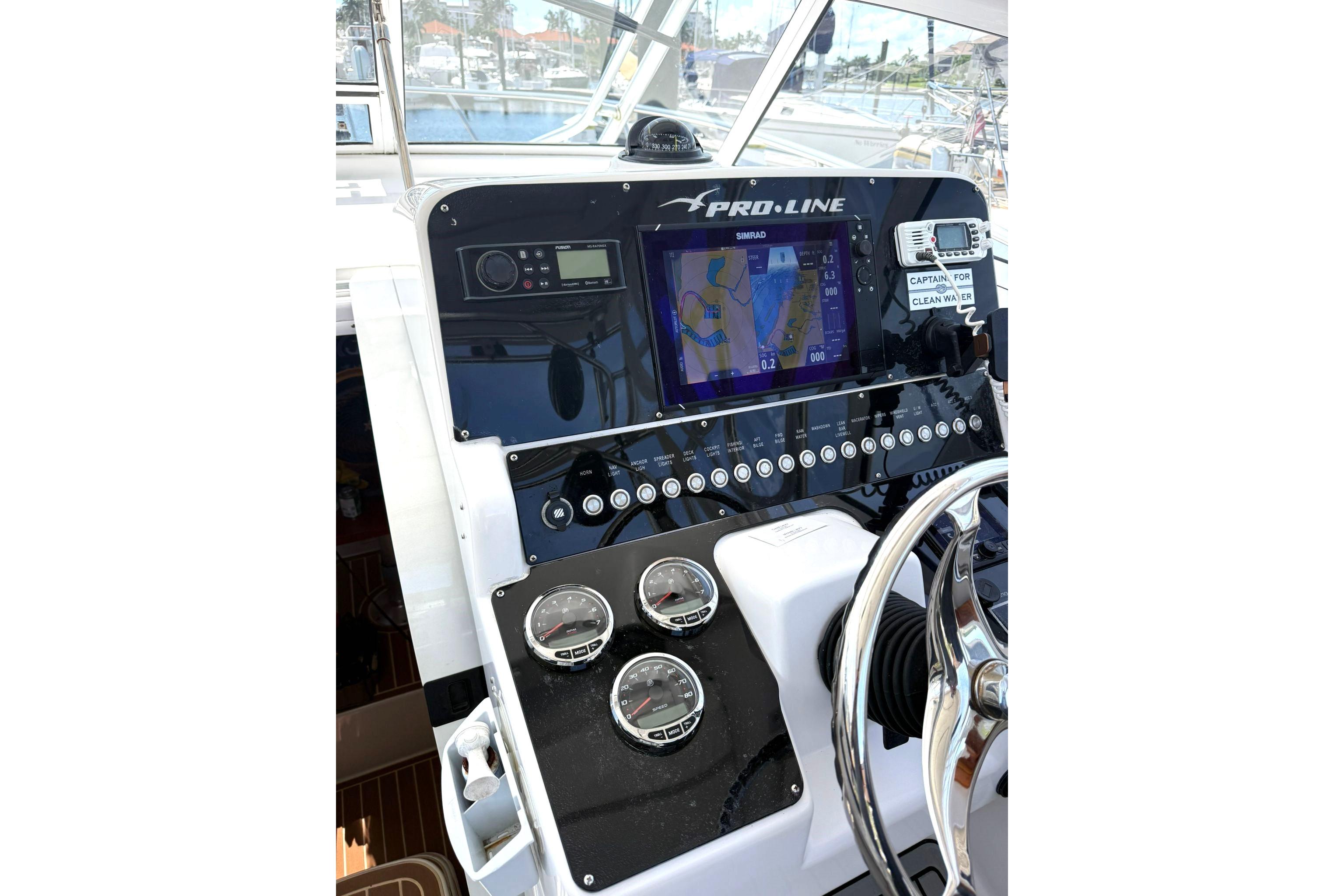 Dashboard of 2006 Pro-Line 32 Express boat with navigation and control instruments.