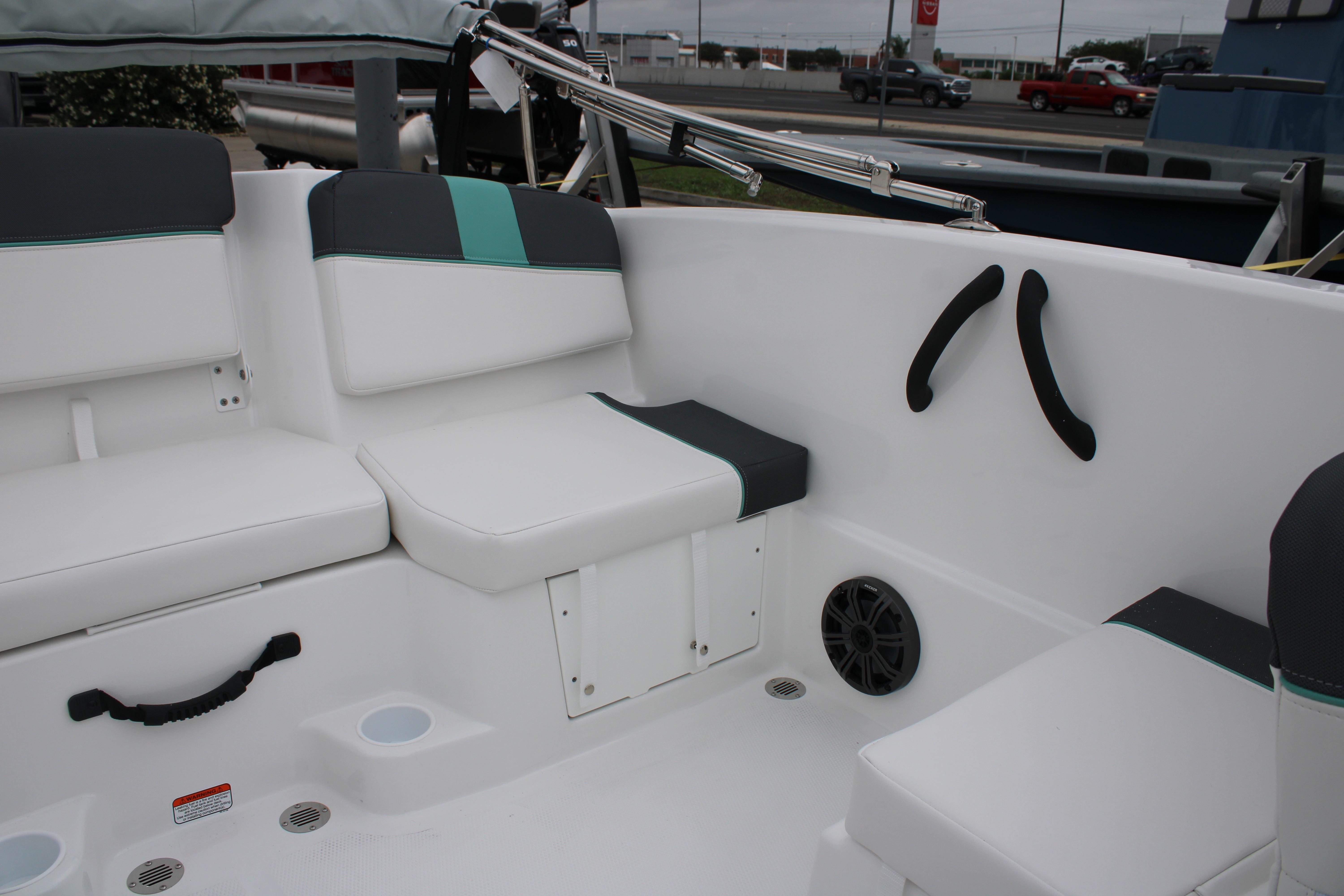Interior seating of a 2026 Tahoe T16 boat with white and teal accents.