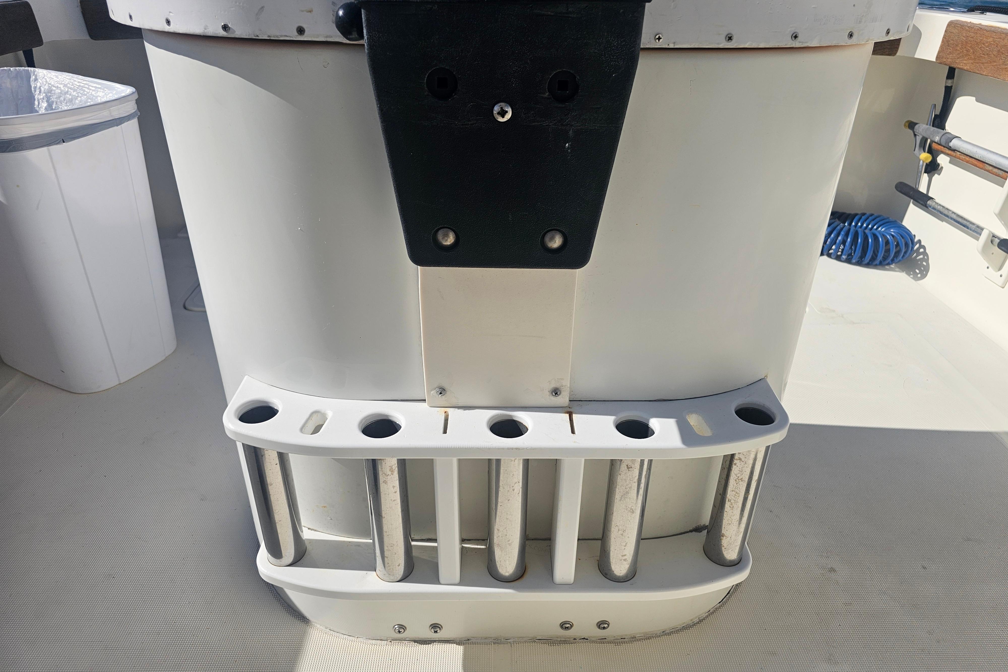 Rod holders on a 2001 Pursuit 3000 Express boat deck.