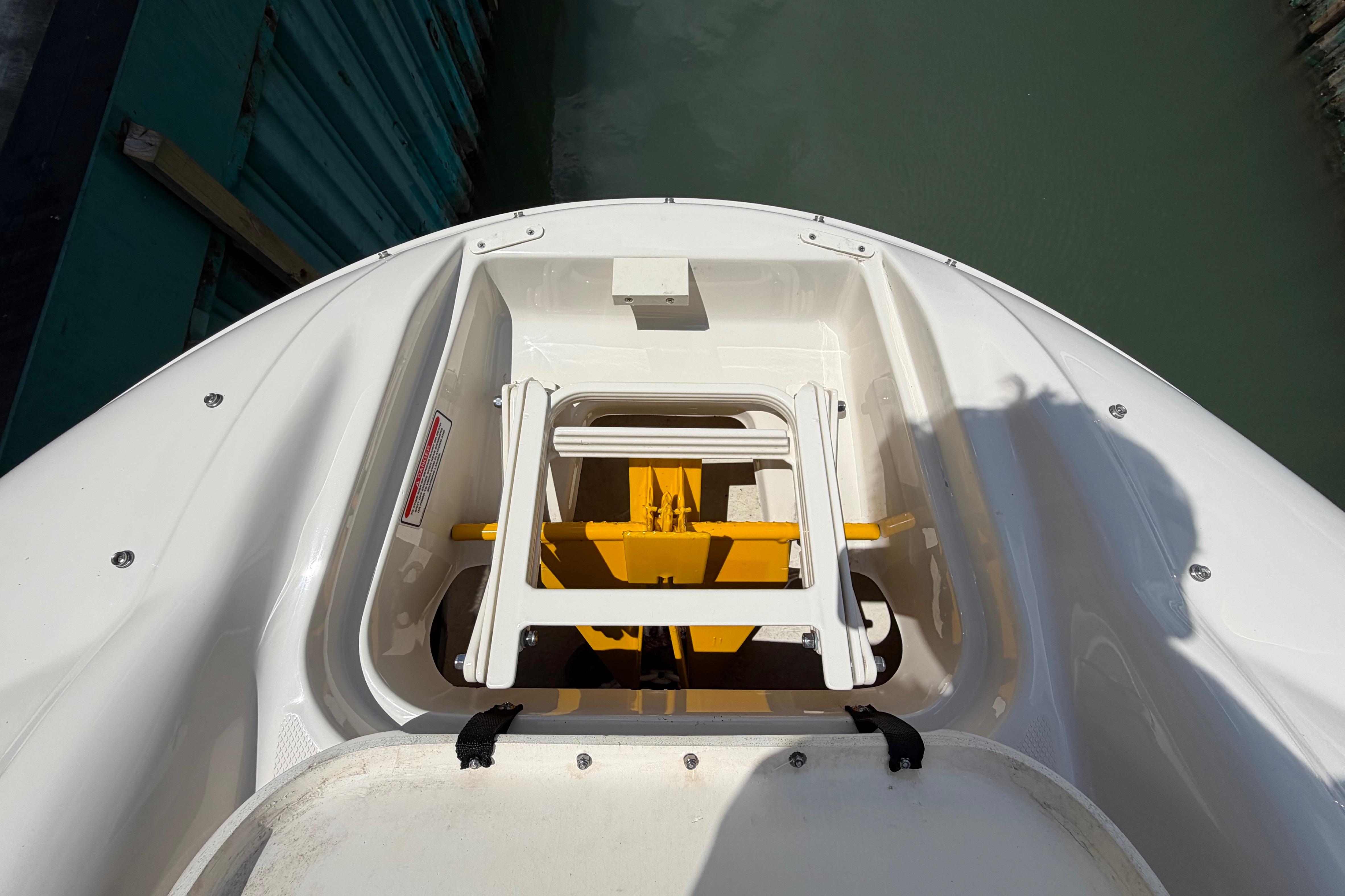 Bow storage compartment on a 2004 Sea Ray 240 Sundeck boat.