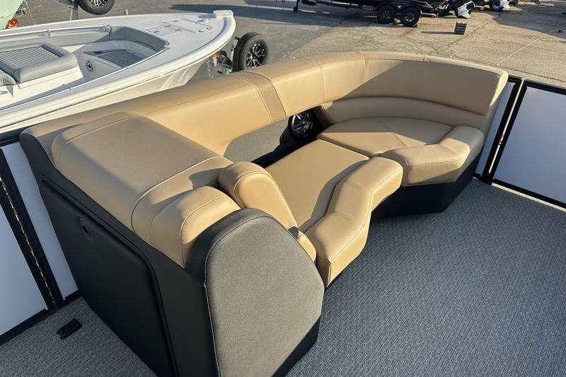 Luxurious seating on 2026 Evotti 523CS boat, featuring tan and black upholstery.