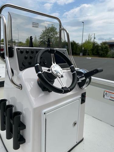 2024 Ranger RB210 boat console with steering wheel and rod holders.