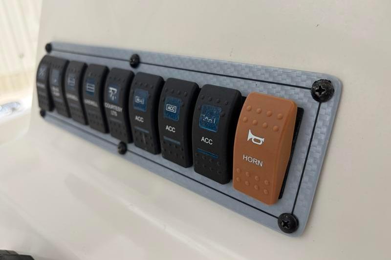 Control panel of 2023 Key West 203 FS boat with labeled switches, including horn.