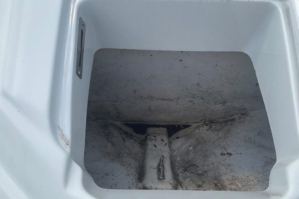 Storage compartment of a 2015 Crownline 236 SC boat, showing interior details.
