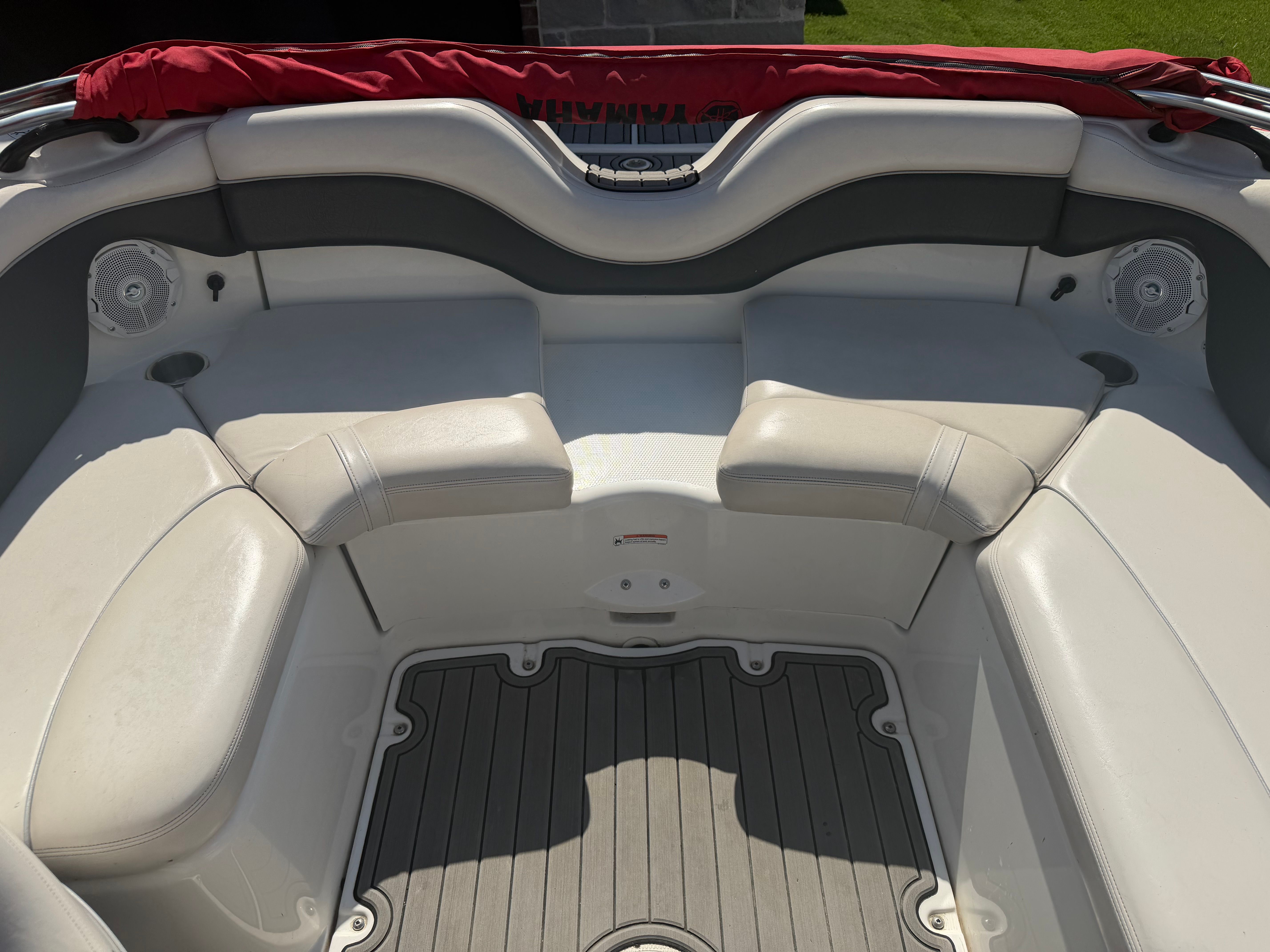 Interior of a 2006 Yamaha AR210 boat with gray seating.