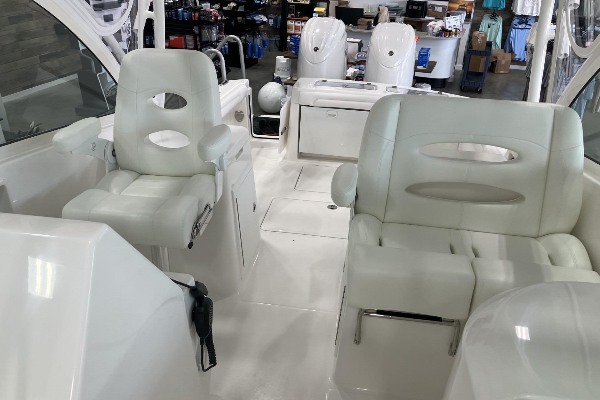 2026 Albemarle 27 Dual Console boat interior with white seating and modern design.