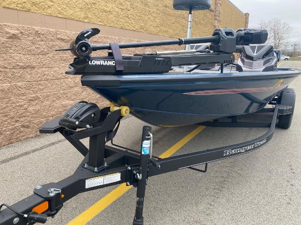 2025 Ranger ALPHA 208 boat on trailer, featuring Lowrance equipment, parked outdoors.