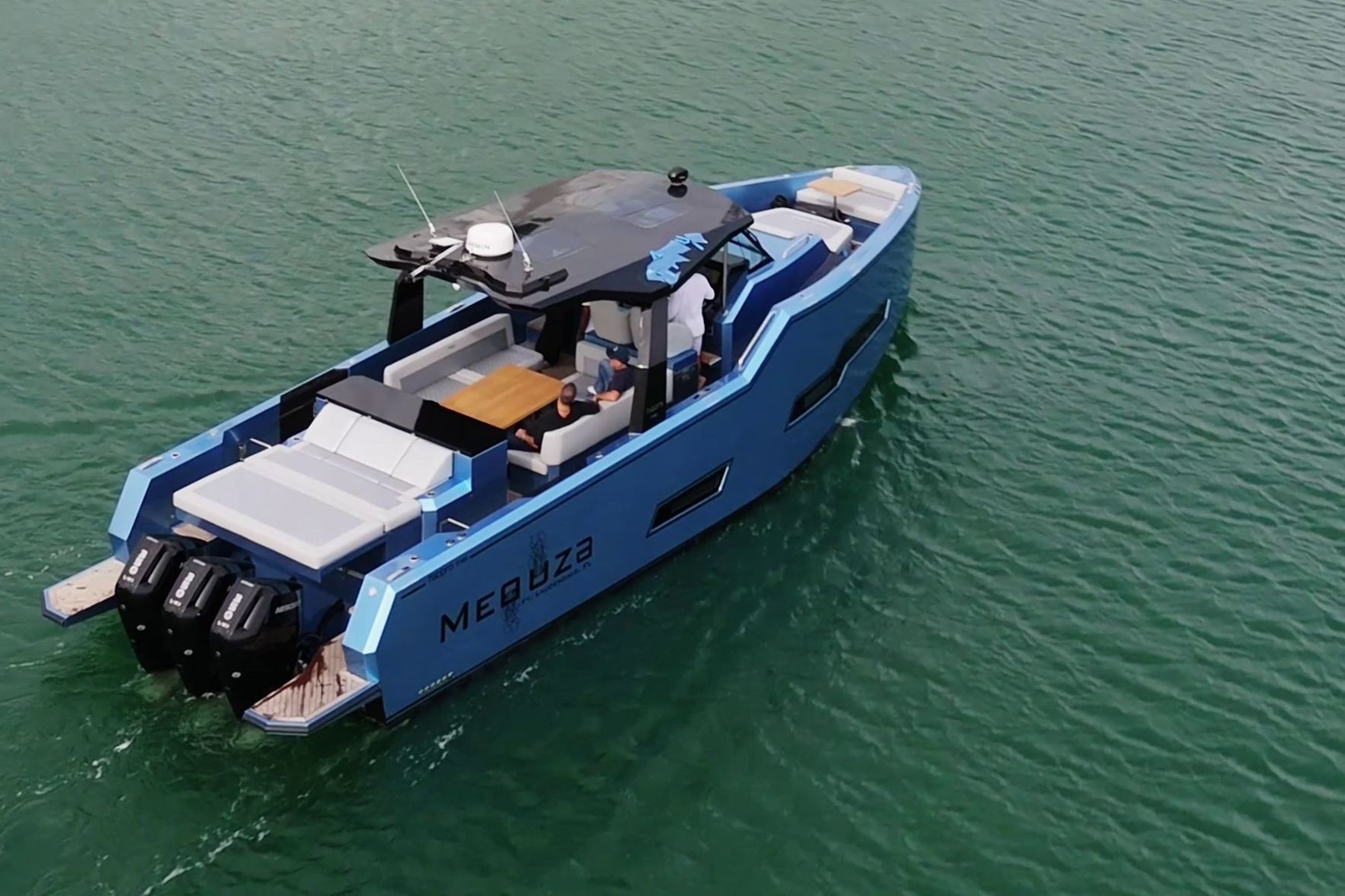 Fabbro F45 Cabrio Outboard 2025 on calm water, featuring a sleek design and three outboard engines.