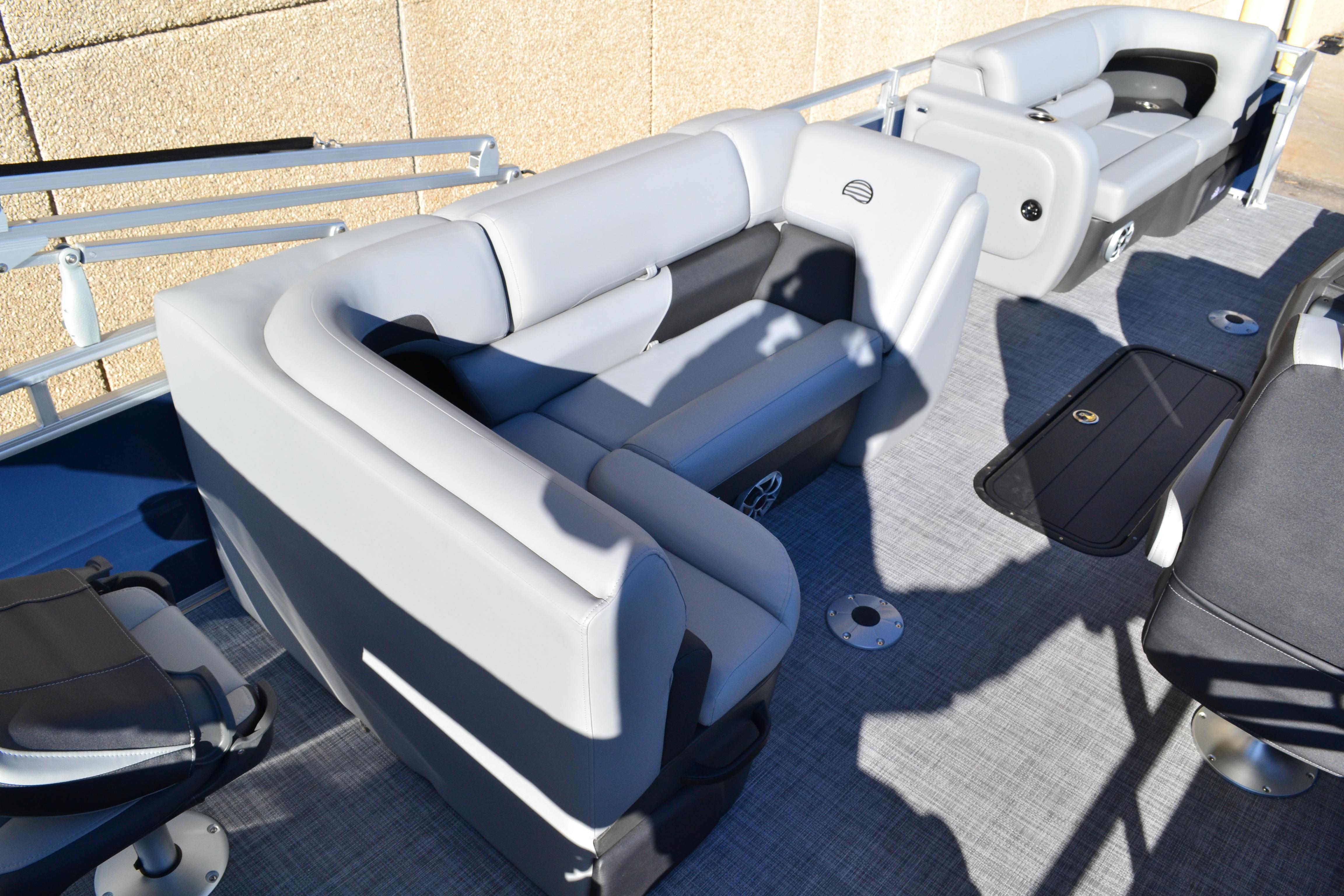 2026 Sun Tracker SportFish 22 XP3 pontoon boat interior with gray seating and flooring.