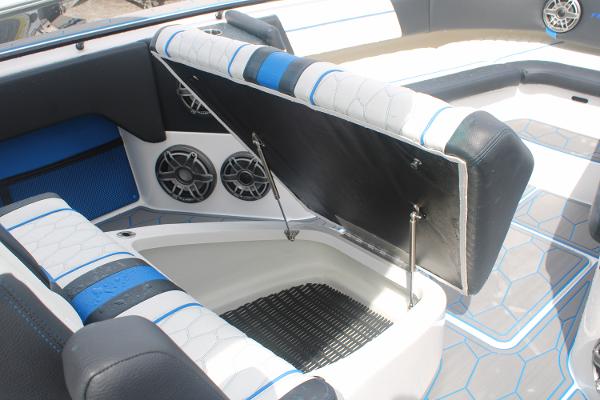 2024 Fountain 34 SC boat interior with open storage compartment and stylish seating.