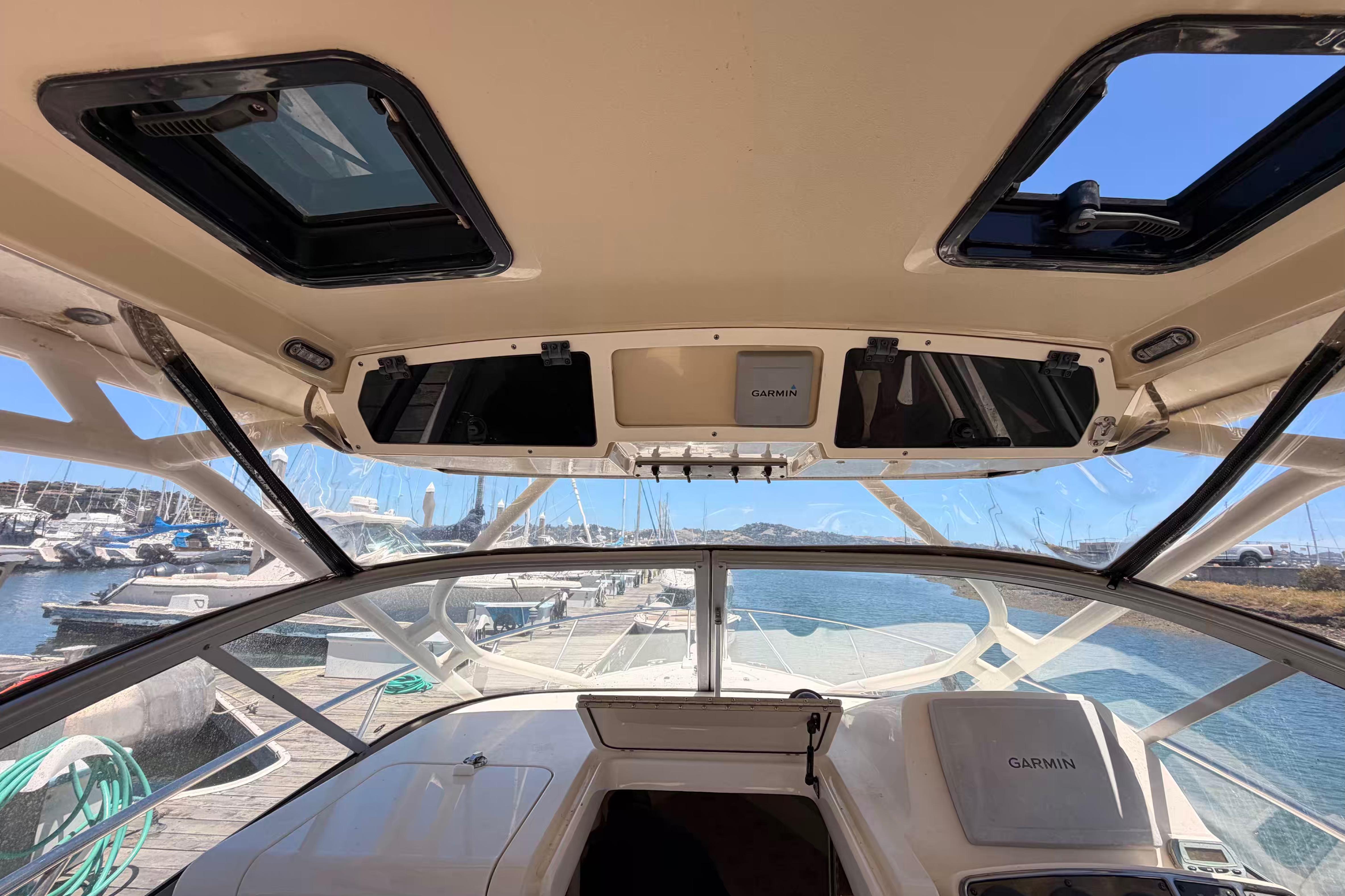 Interior view of 2007 Scout 262 Abaco boat with Garmin equipment at a marina.
