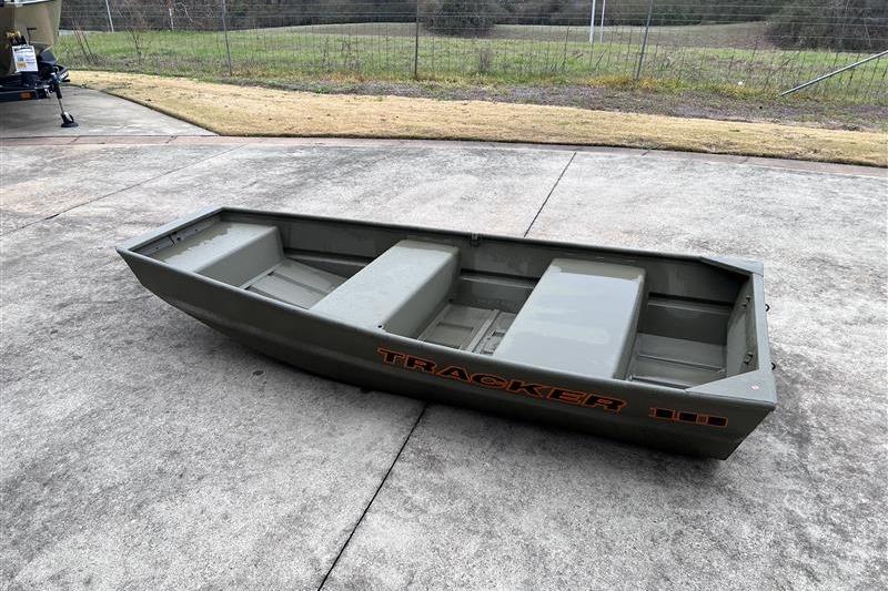2026 Tracker Grizzly 10 Jon boat on concrete, with grassy background.