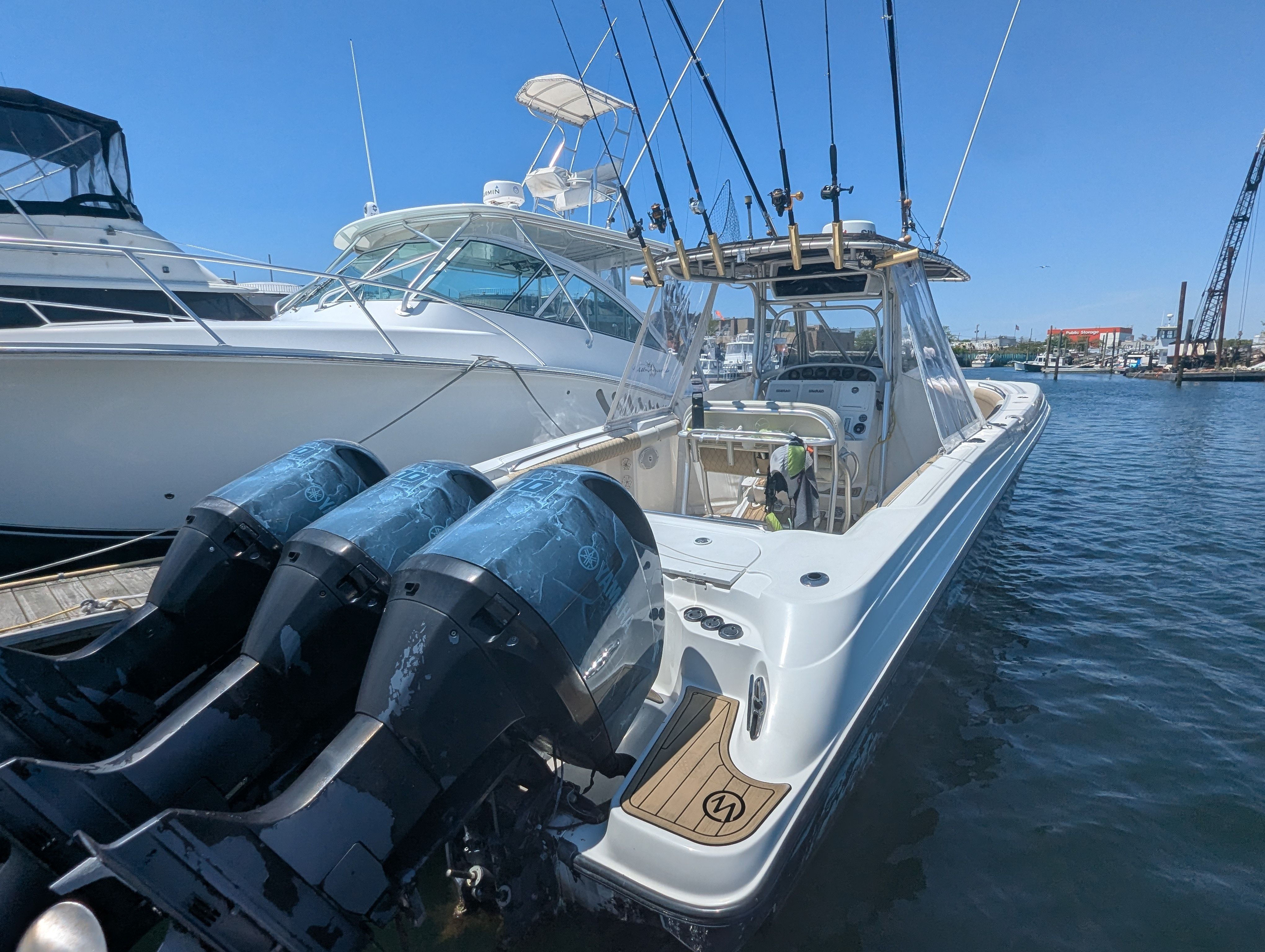 2005 Wellcraft 35 CCF boat docked with outboard engines.