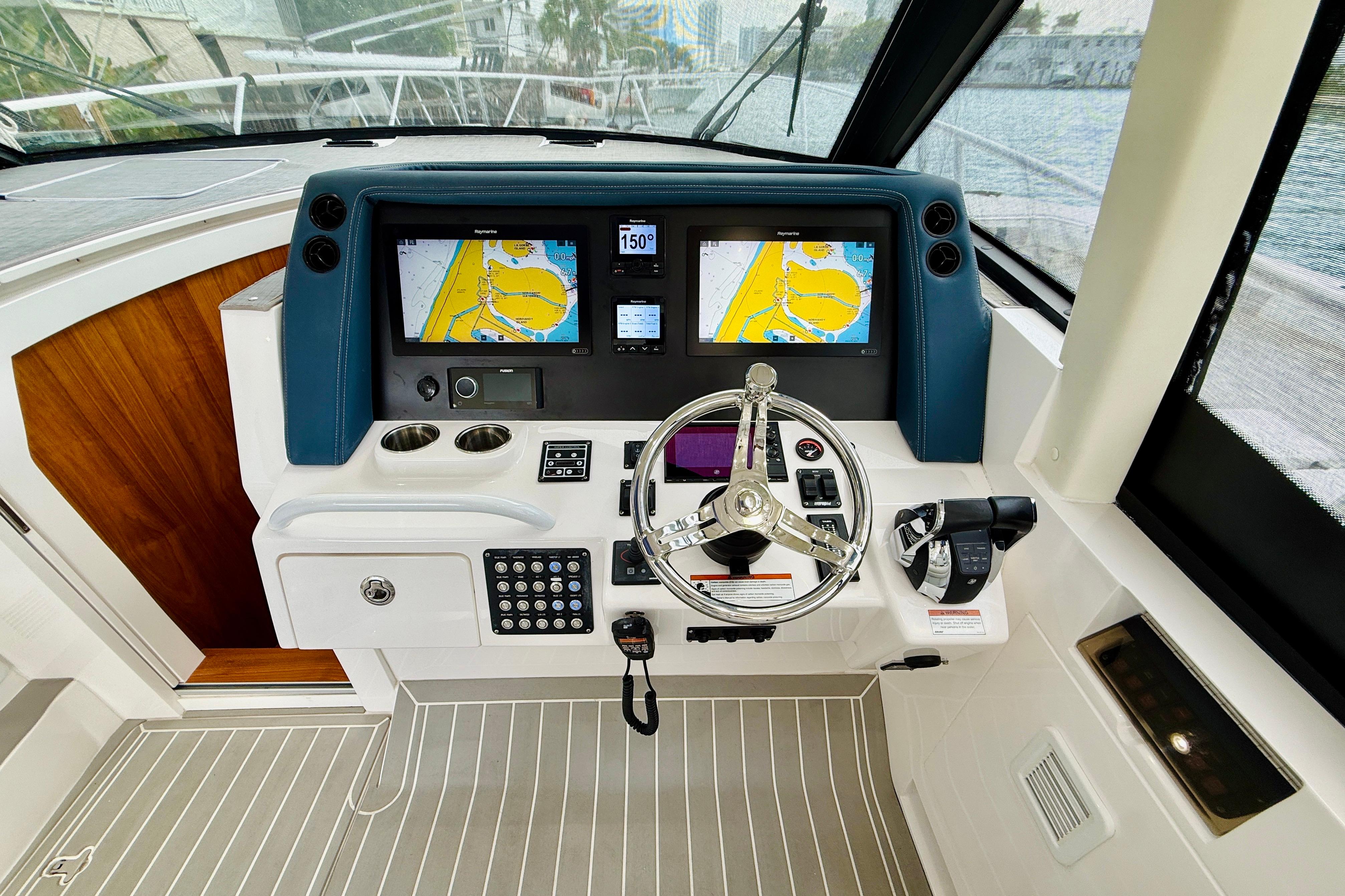 2021 Intrepid 410 Evolution helm with dual navigation screens and modern controls.