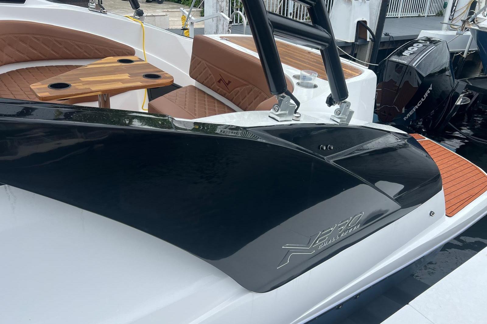 2024 NX Boats NX270 with luxurious seating and sleek design at the dock.