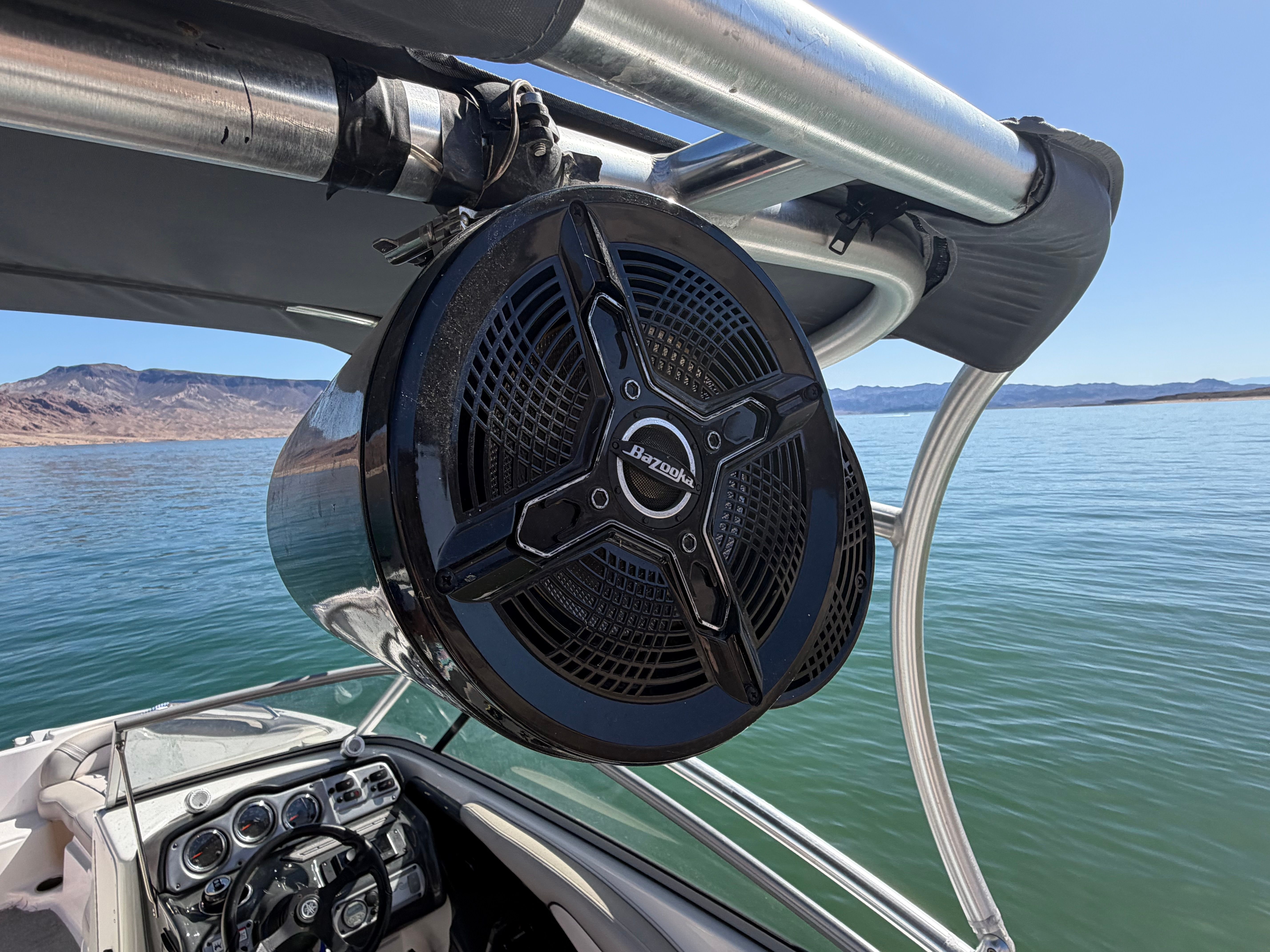 2011 Yamaha AR240 HO with speaker on calm water.