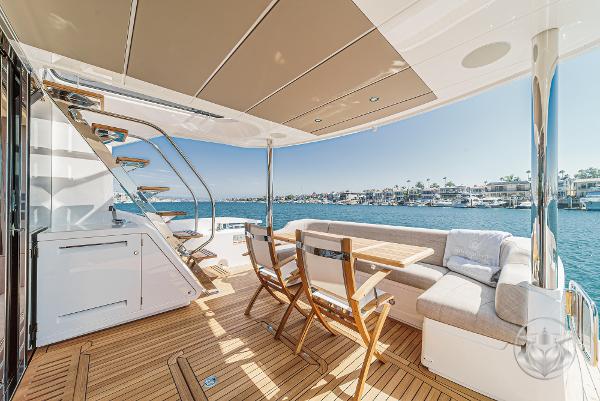 Luxurious 2025 Sunseeker Manhattan 68 yacht deck with seating and ocean view.