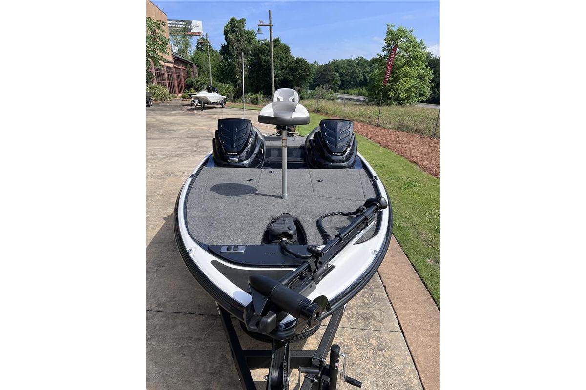 2026 Nitro Z17 fishing boat with trolling motor, parked outdoors on a sunny day.
