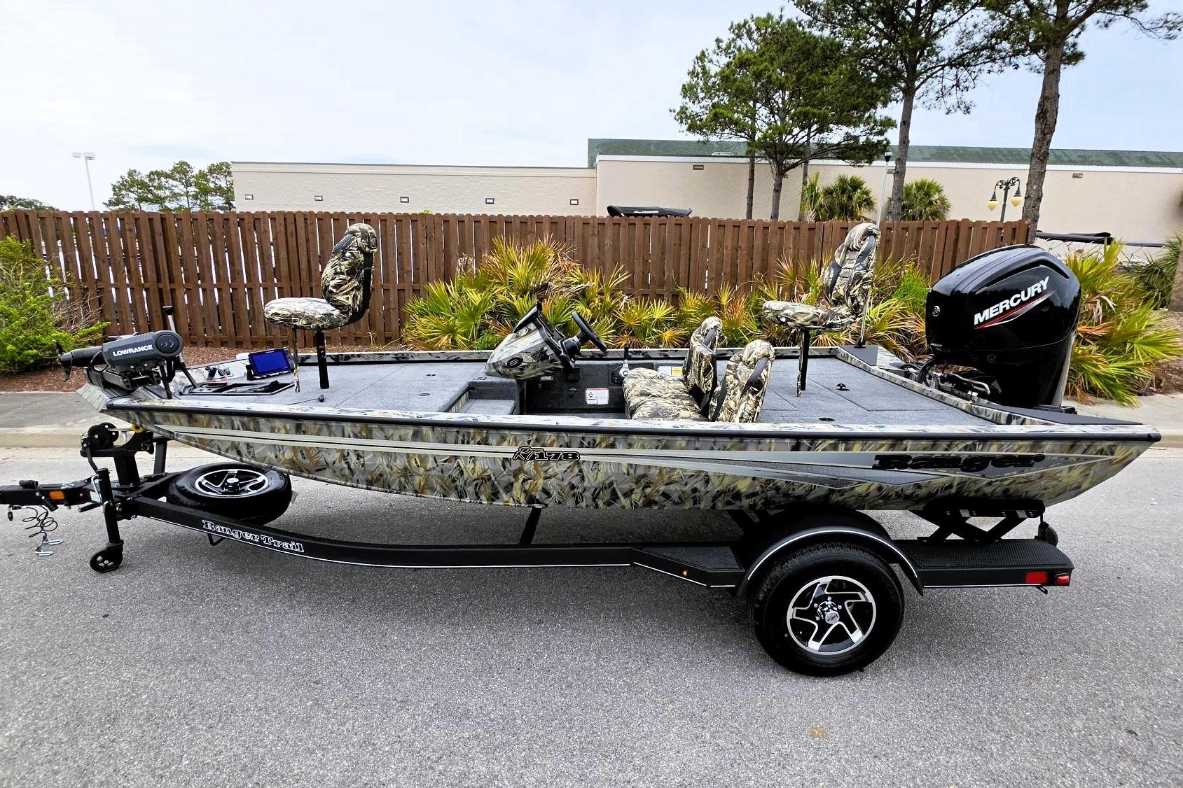 2026 Ranger RT178 fishing boat with camouflage seats and Mercury outboard motor.