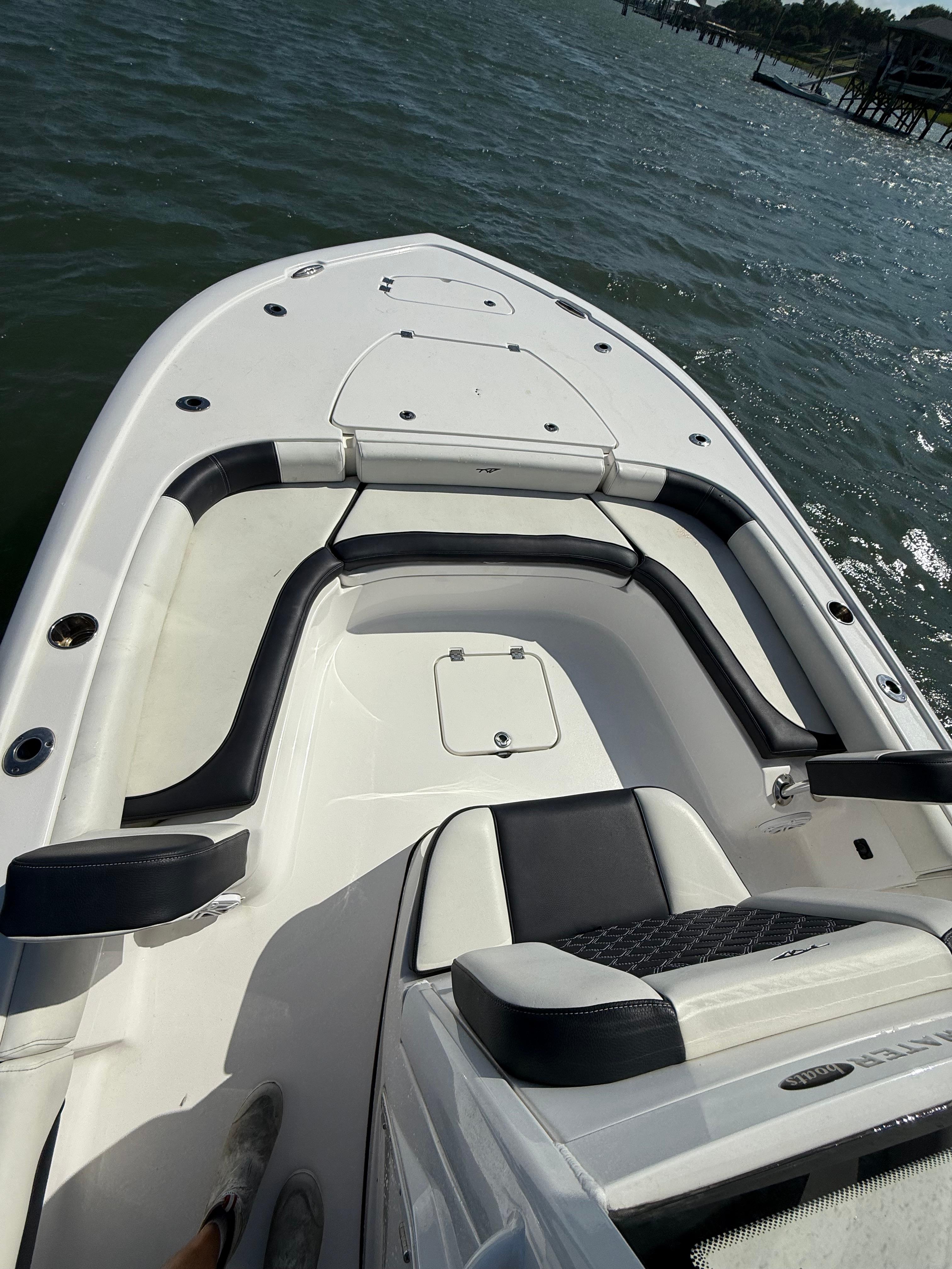 2023 Tidewater 2500CB boat interior with cushioned seating on the water.